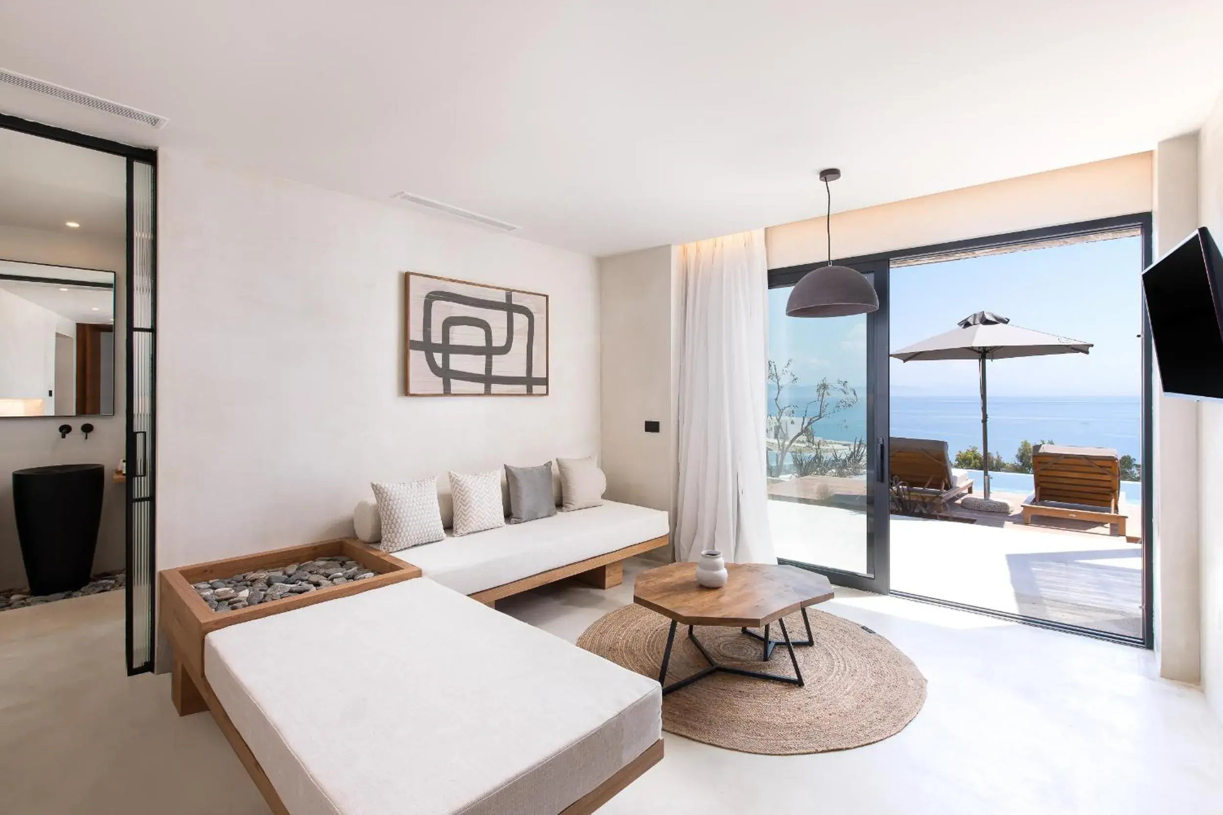 Living room, Bed in KOIA All - Suite Well Being Resort - Adults Only Living room, Bed in KOIA All - Suite Well Being Resort - Adults Only