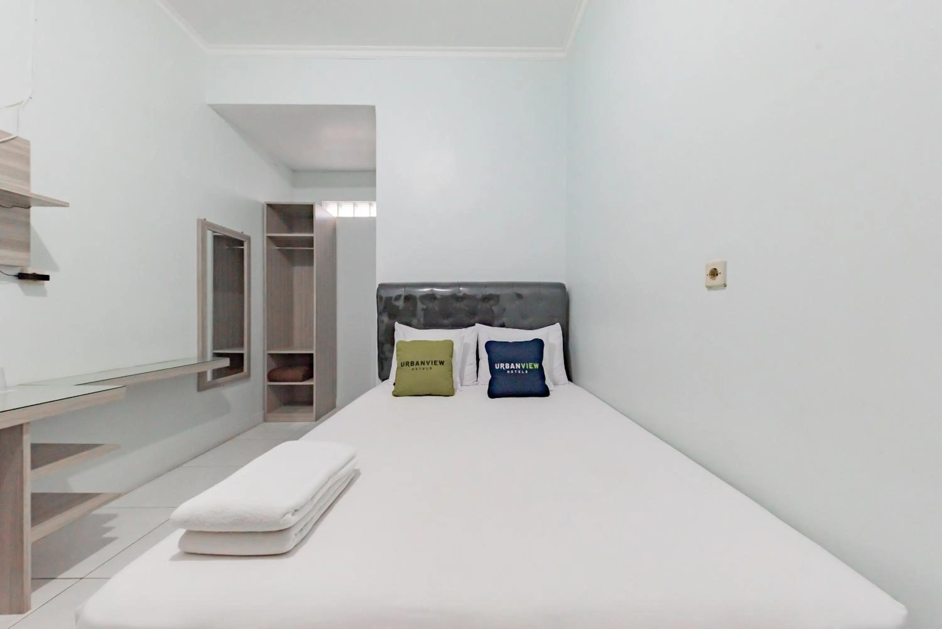 Bed in Urbanview Hotel Sunday Cirebon by RedDoorz