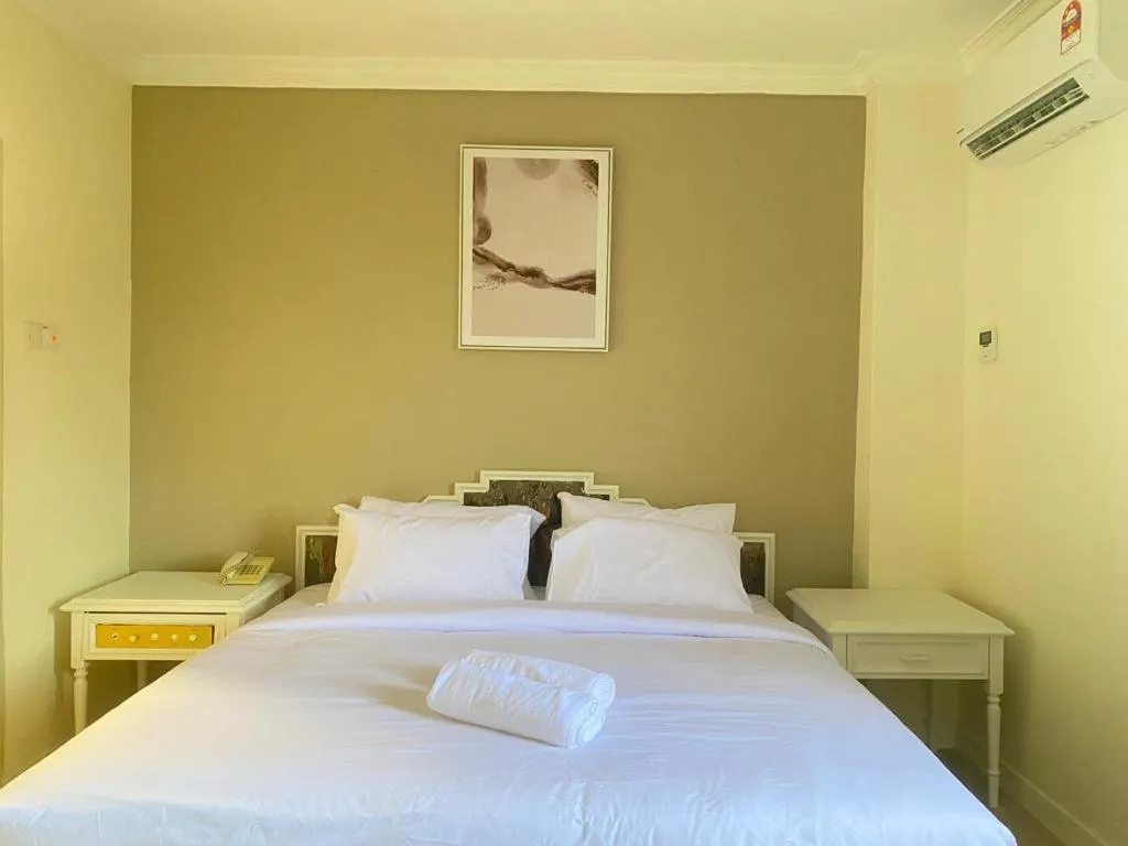 Bed in SWISS AVENUE HOTEL