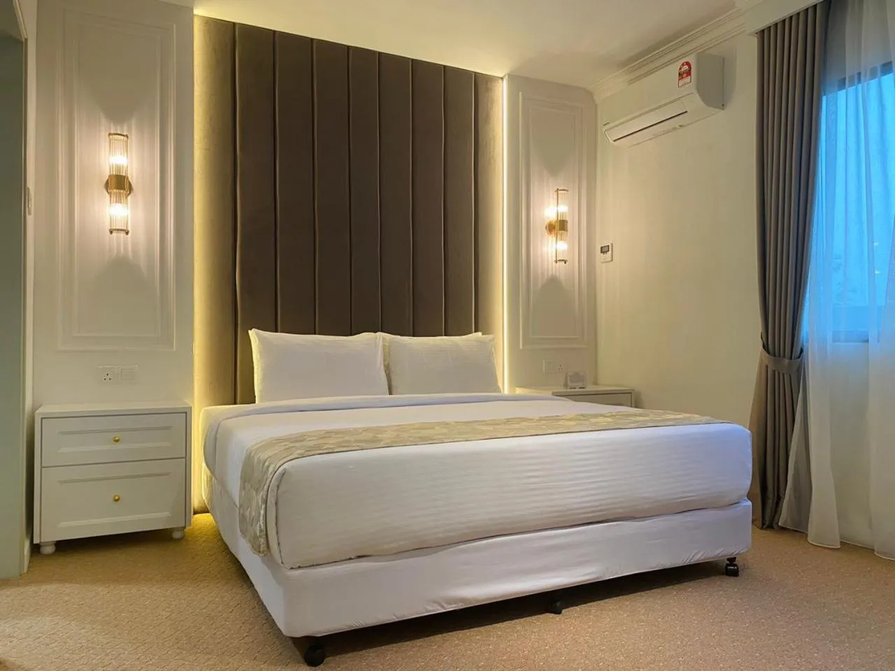 Bed in SWISS AVENUE HOTEL