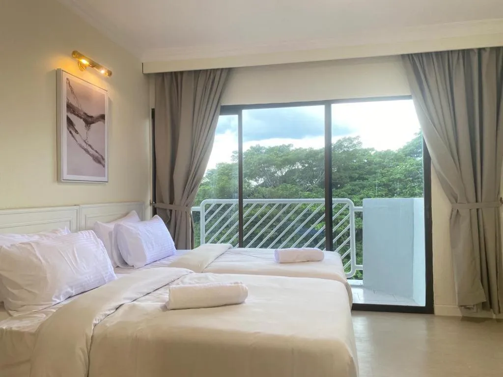 Bed in SWISS AVENUE HOTEL