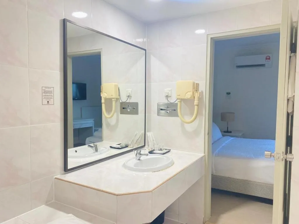 Bed in SWISS AVENUE HOTEL