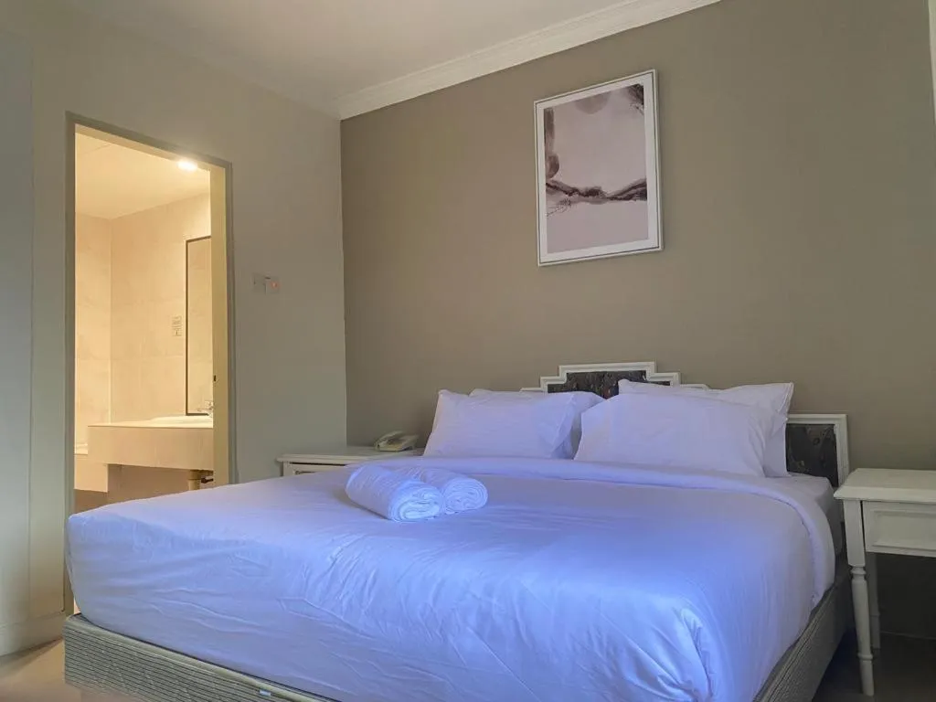 Bed in SWISS AVENUE HOTEL