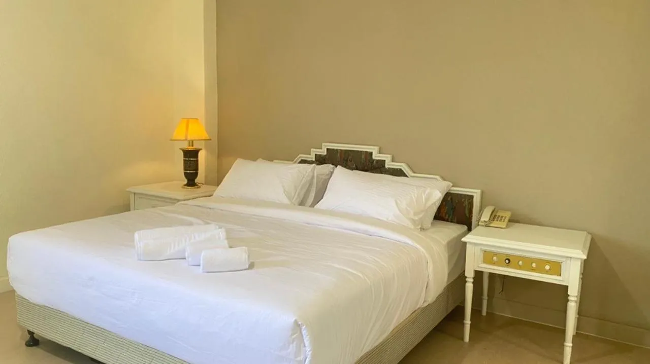 Bed in SWISS AVENUE HOTEL