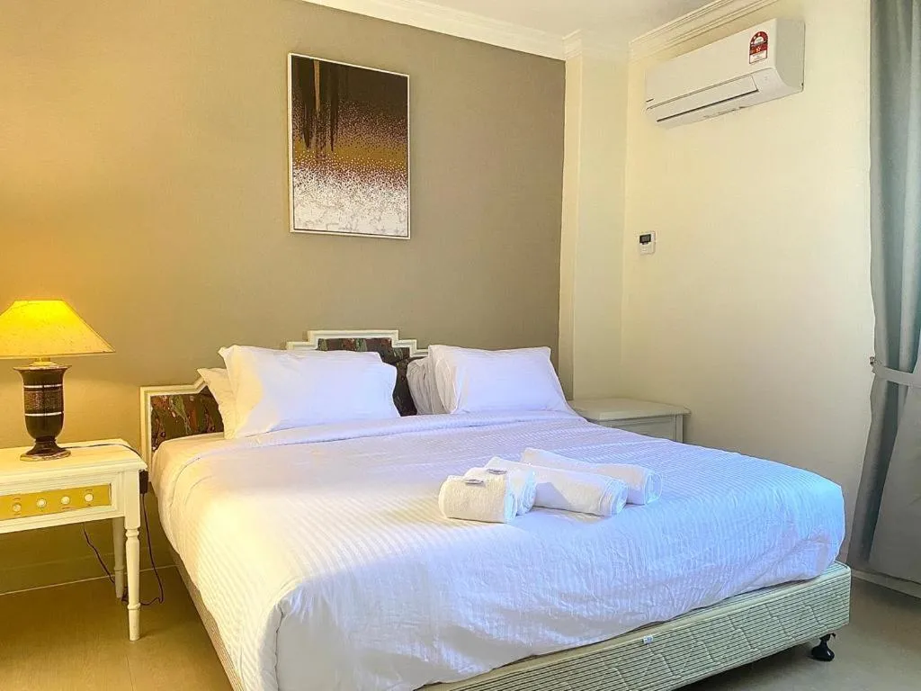 Bed in SWISS AVENUE HOTEL