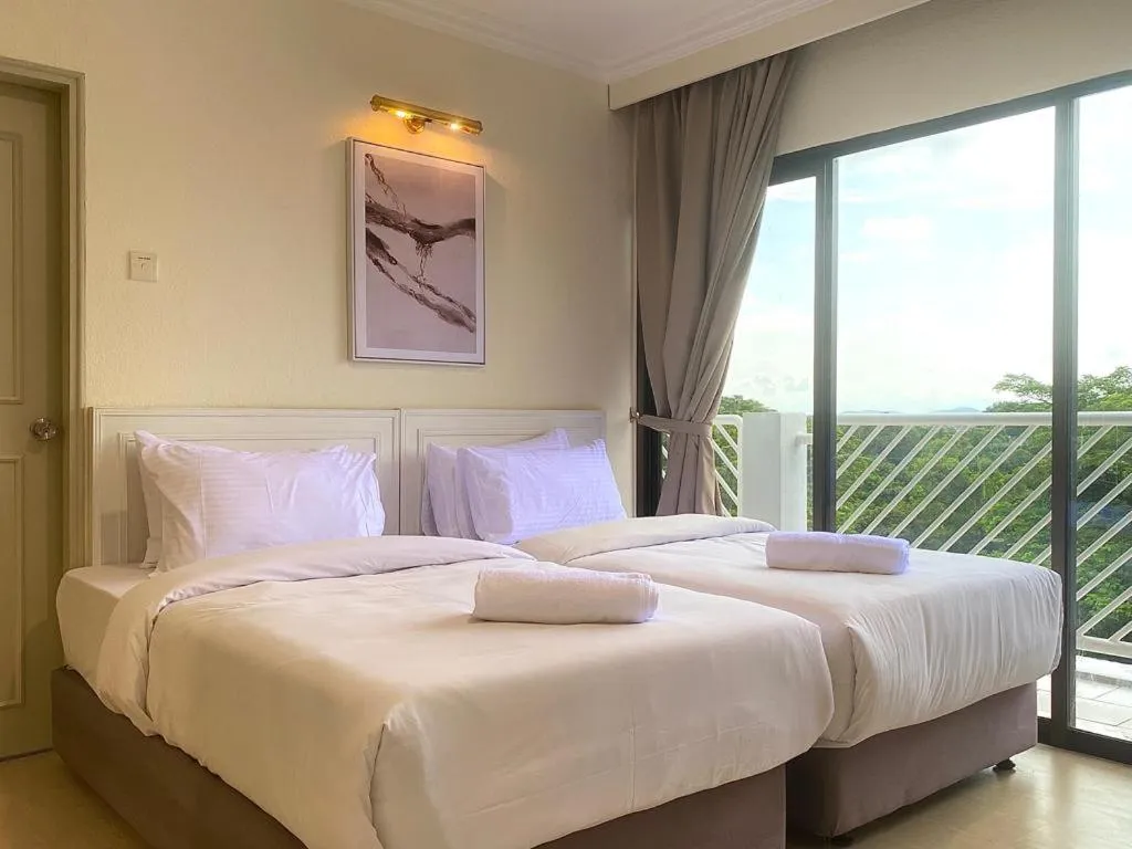 Bed in SWISS AVENUE HOTEL