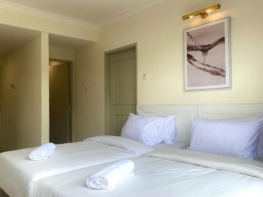 Bed in SWISS AVENUE HOTEL