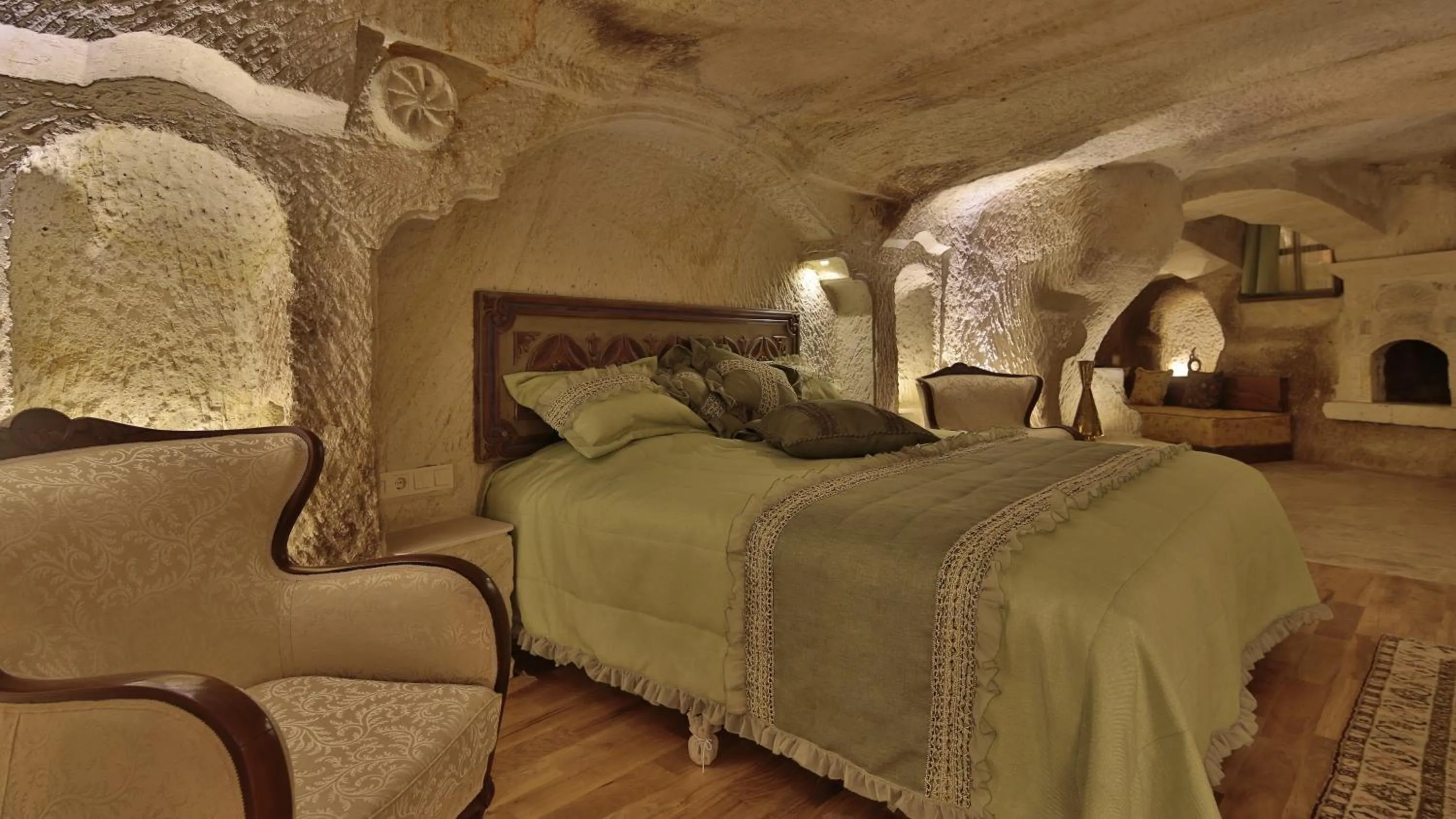 Living room, Bed in Golden Cave Suites