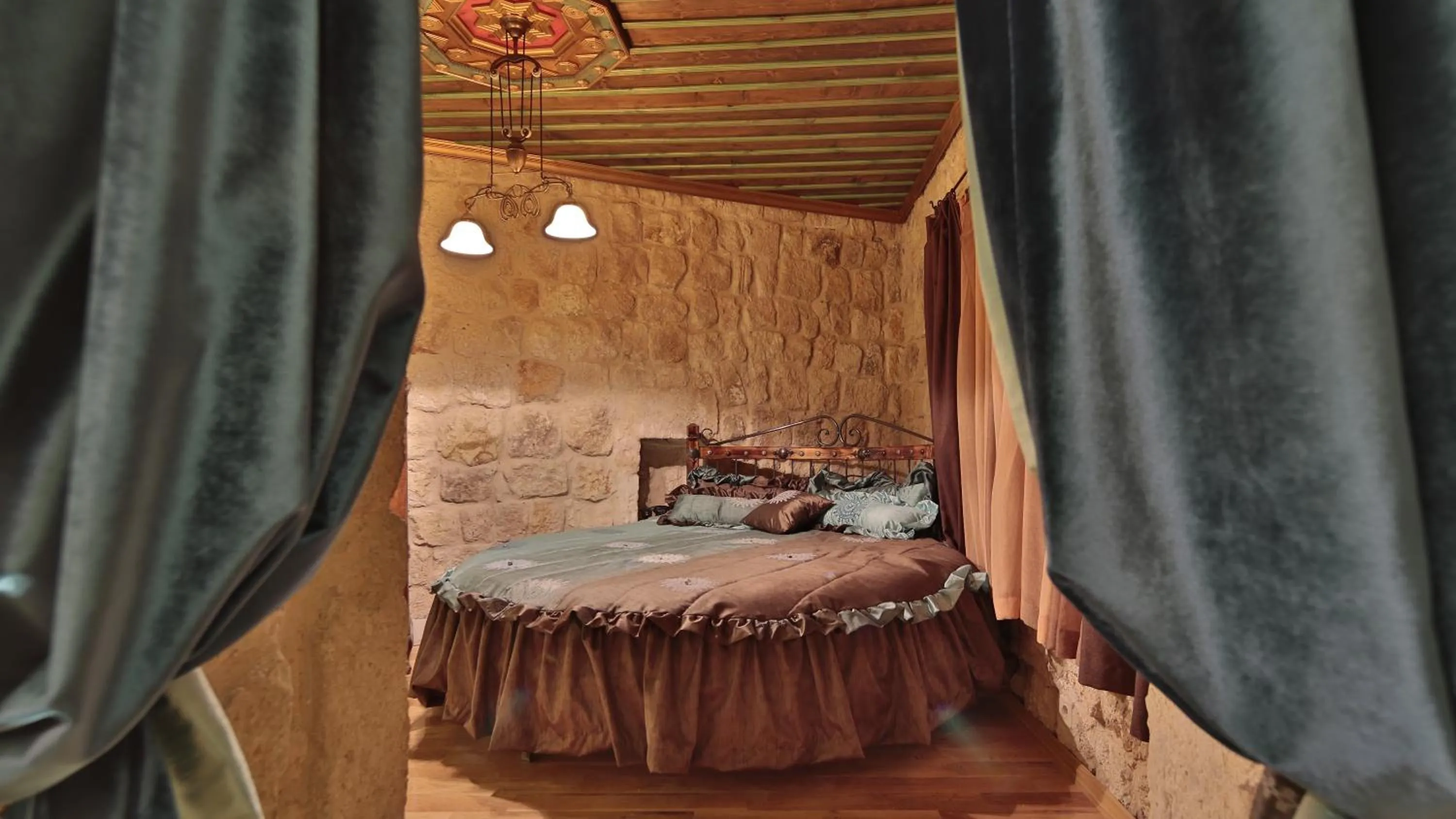 Living room, Bed in Golden Cave Suites