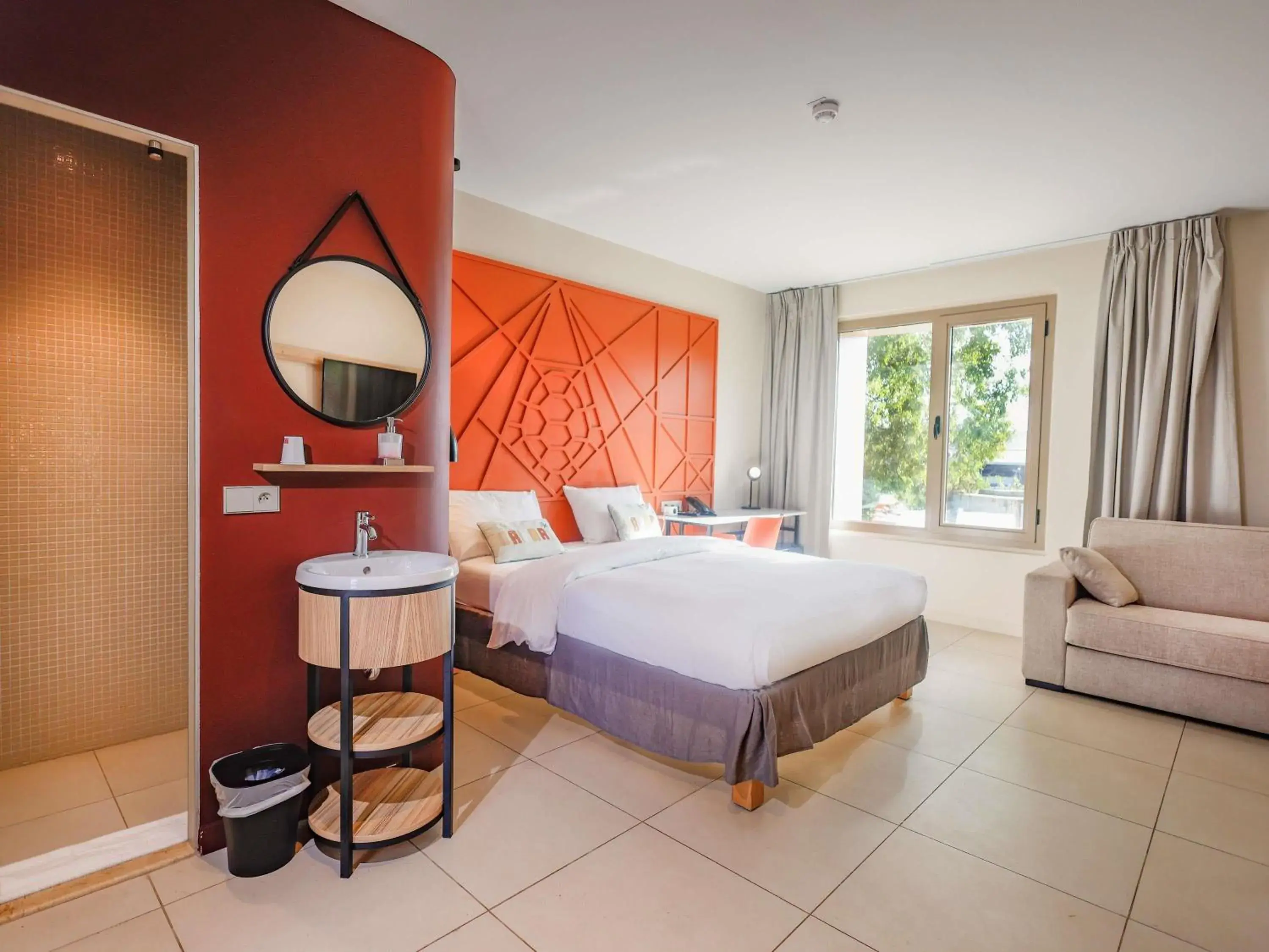 Superior Room with One Double Bed and One Single Bed - Lagoon View in Ibis Styles Mayotte Aéroport Superior Room with One Double Bed and One Single Bed - Lagoon View in Ibis Styles Mayotte Aéroport