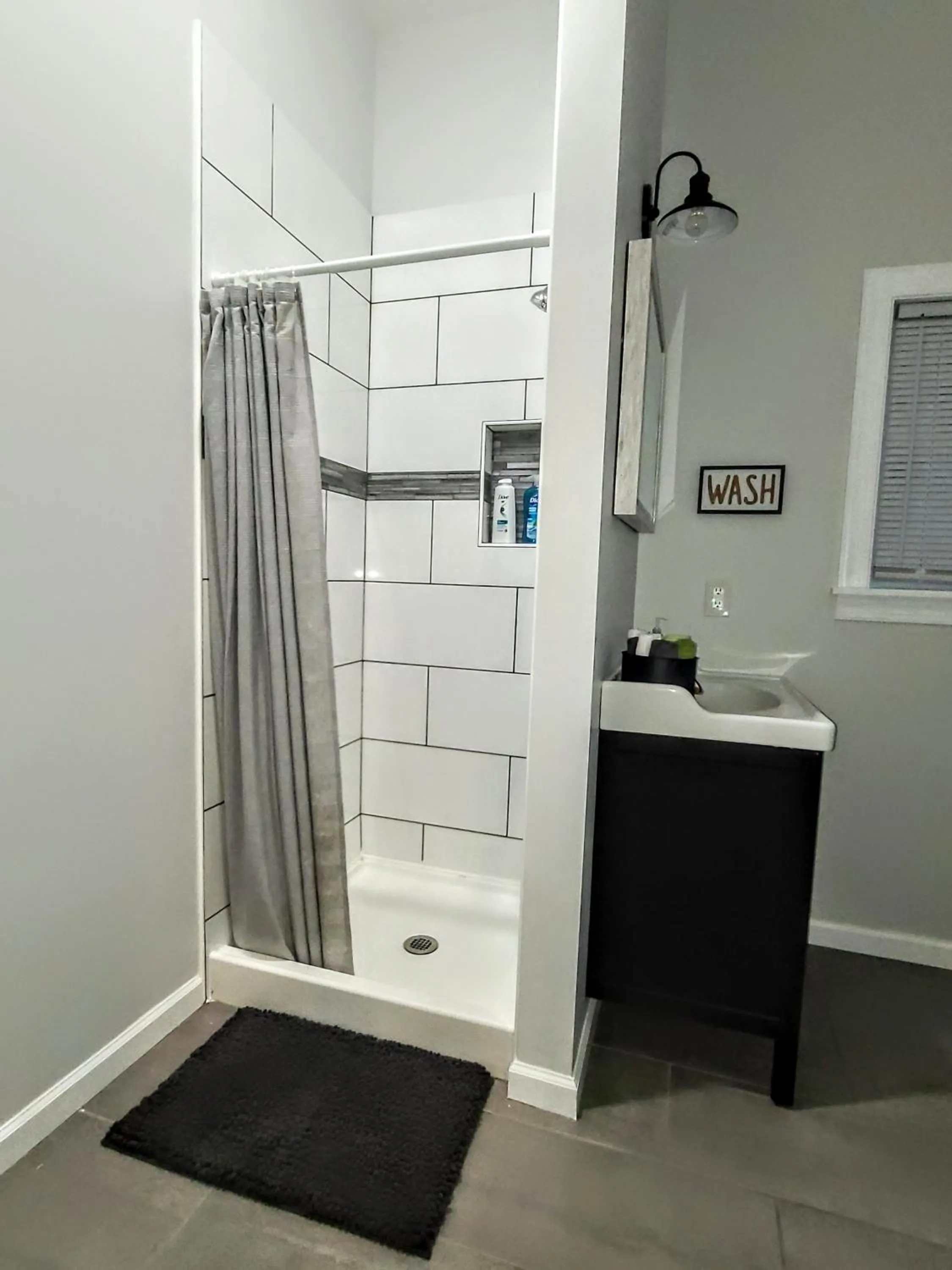 Shower in The Great Pink Lady with Huge Wrap Around Porch!