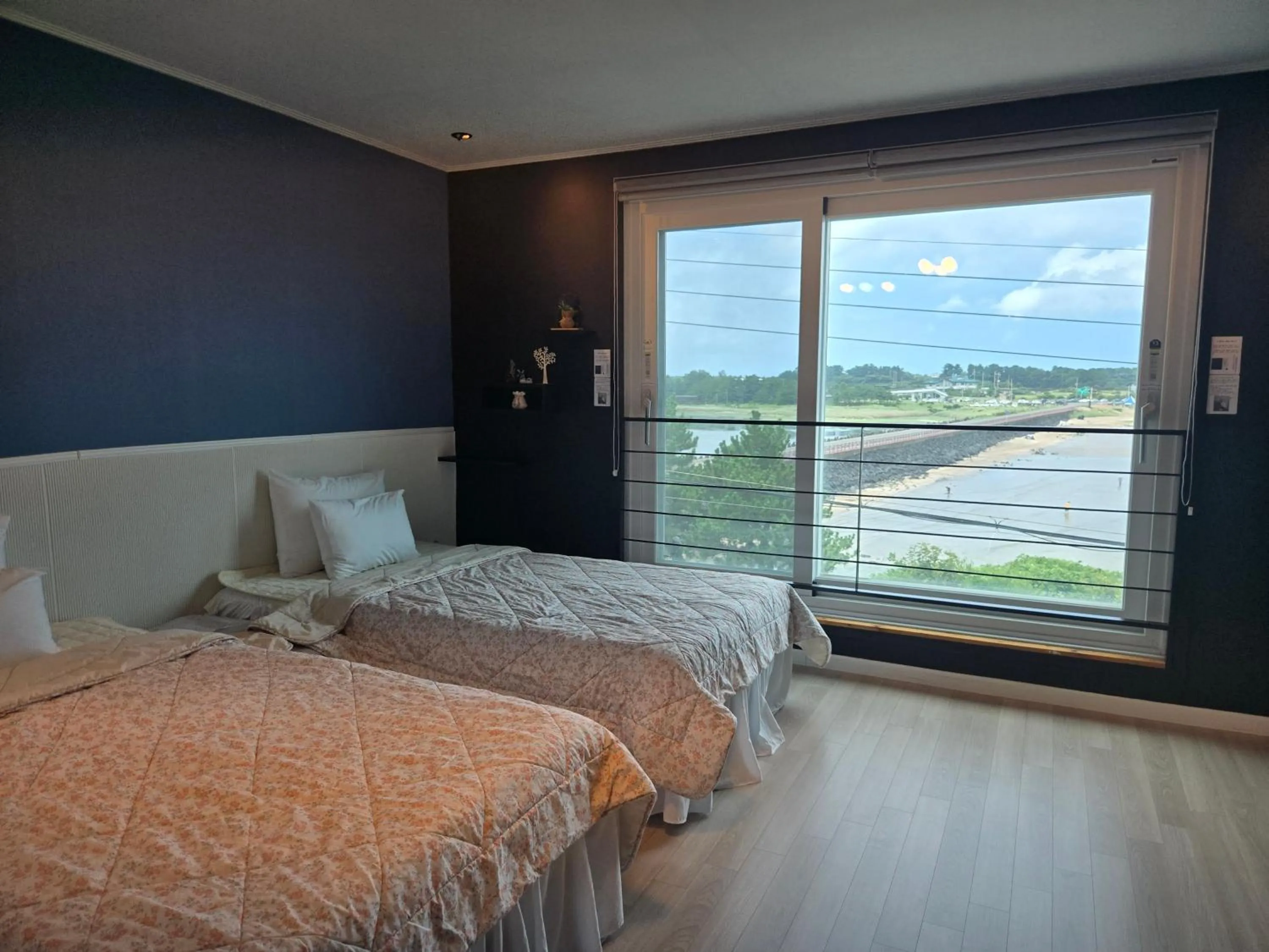 Bed in Jeju Gaviota Pension