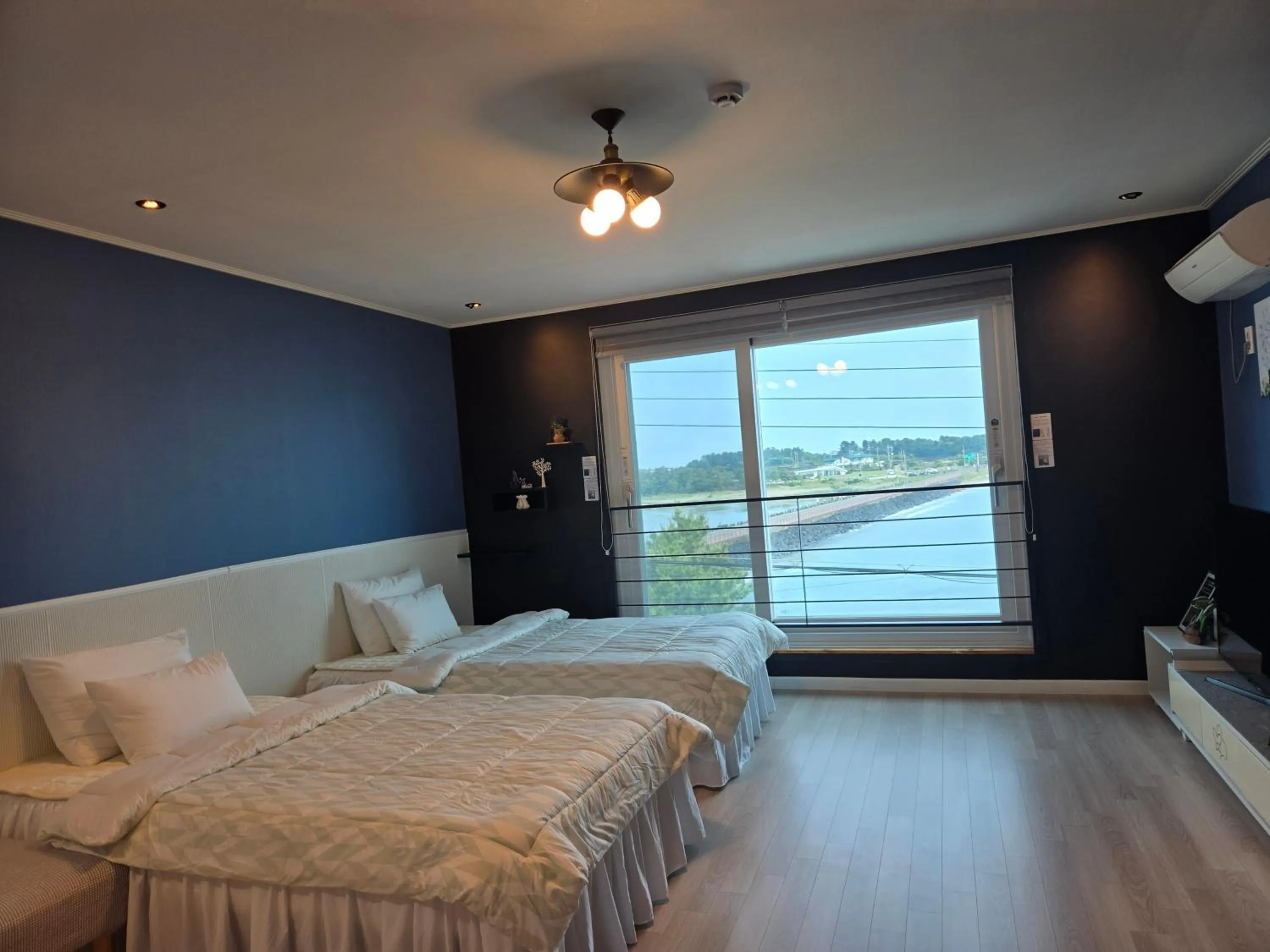 Bed in Jeju Gaviota Pension