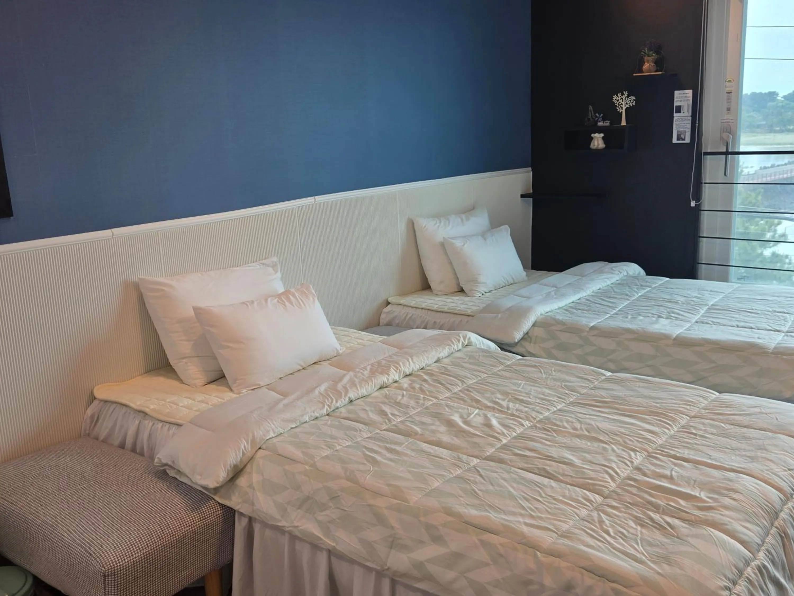 Bed in Jeju Gaviota Pension