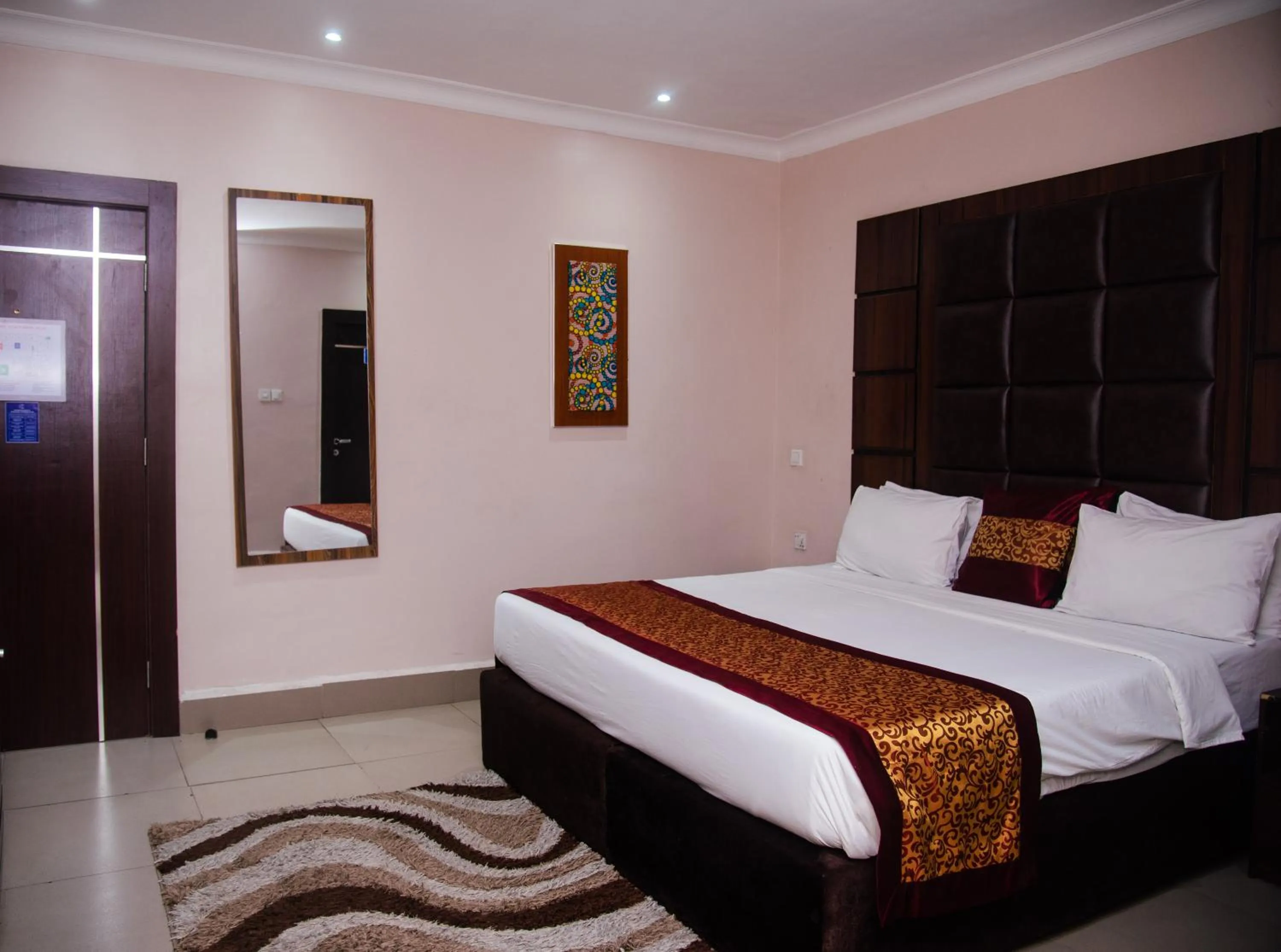 Bedroom, Bed in Golden Tulip Garden City Hotel - Rivotel