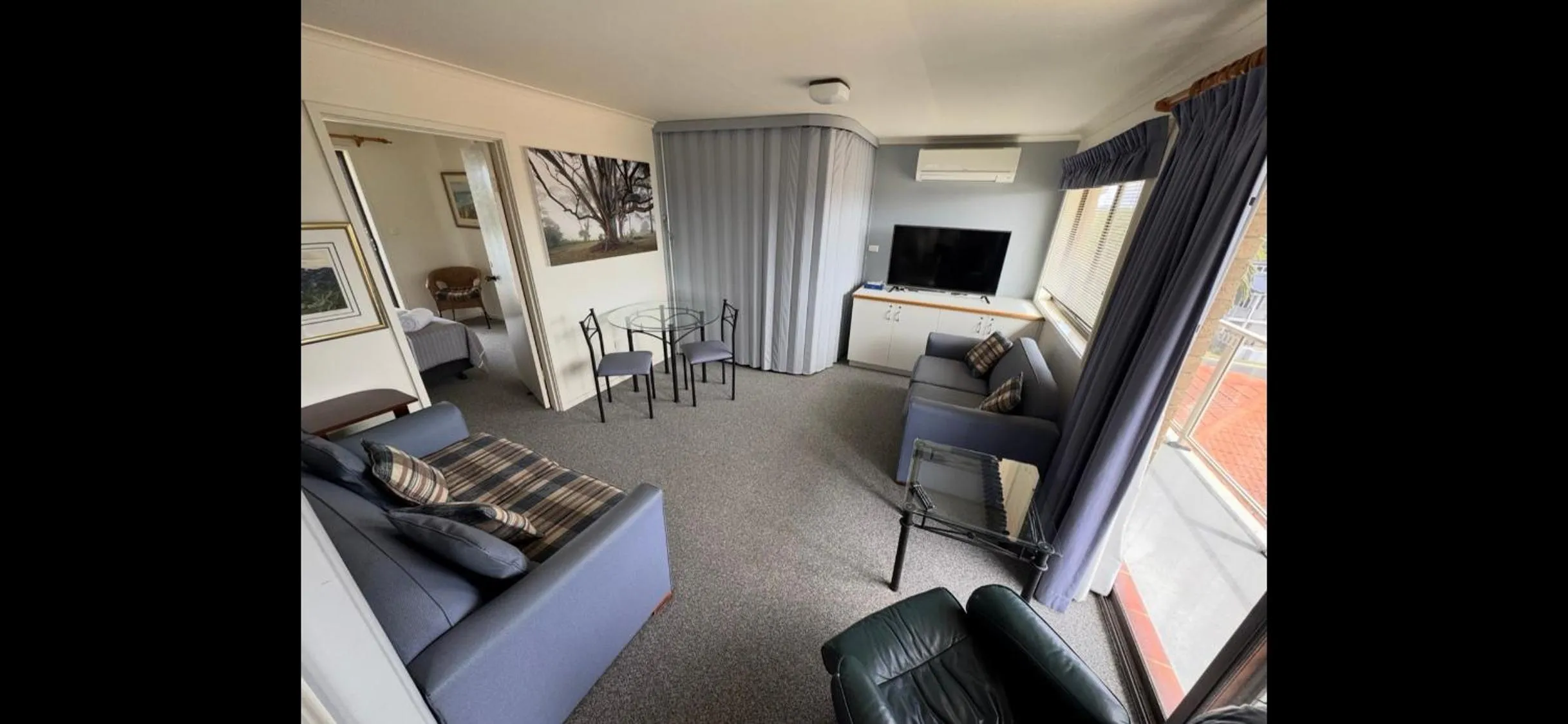 Living room in Narooma Palms Holiday Apartments