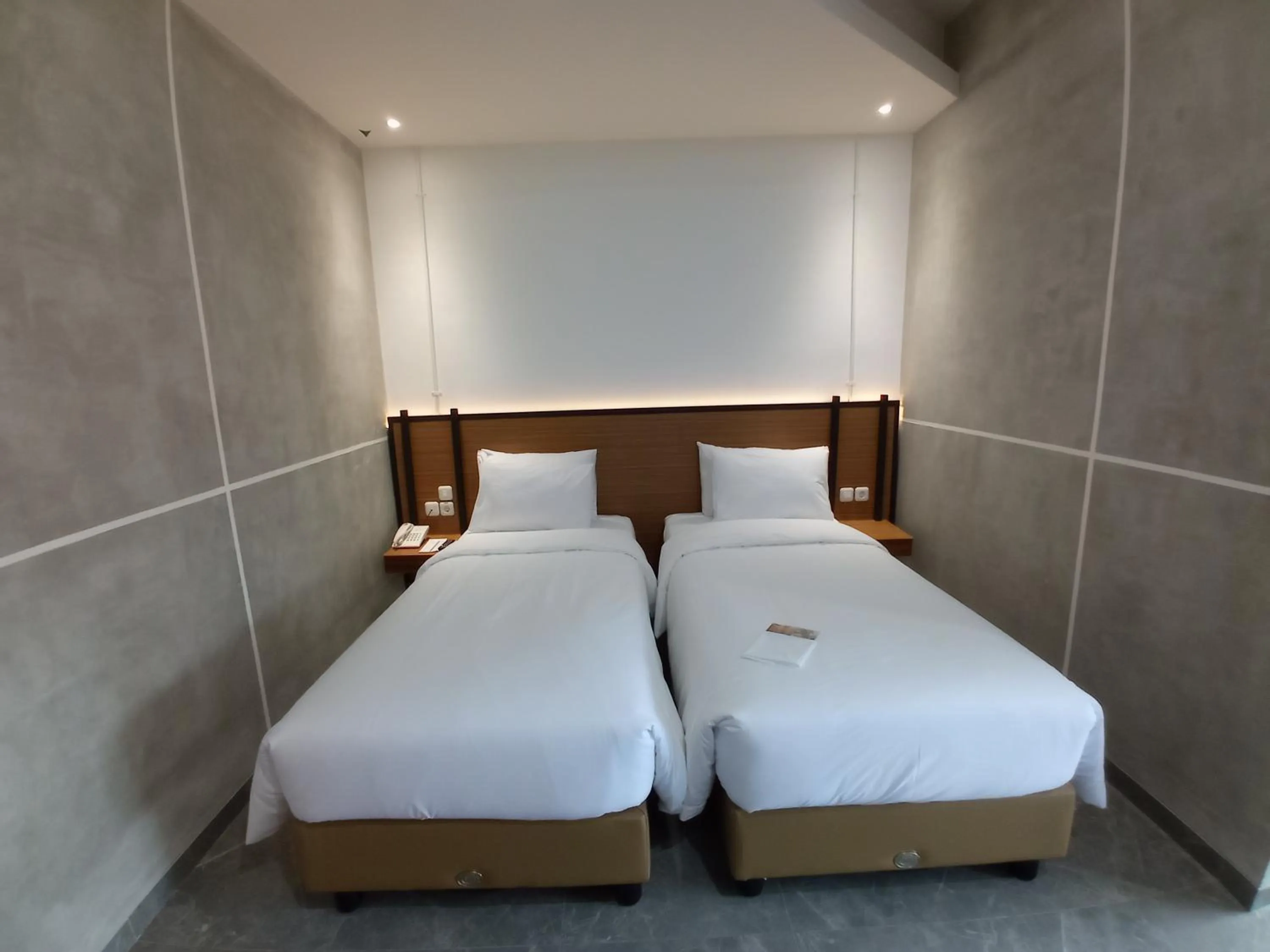 Bed in Rid's Hotel Palembang