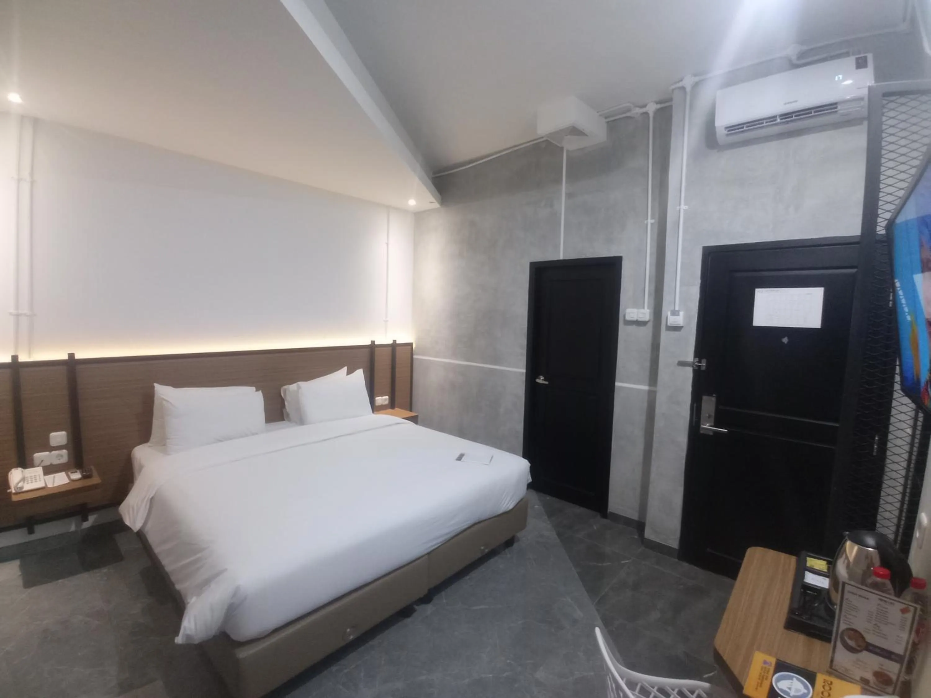 Bed in Rid's Hotel Palembang