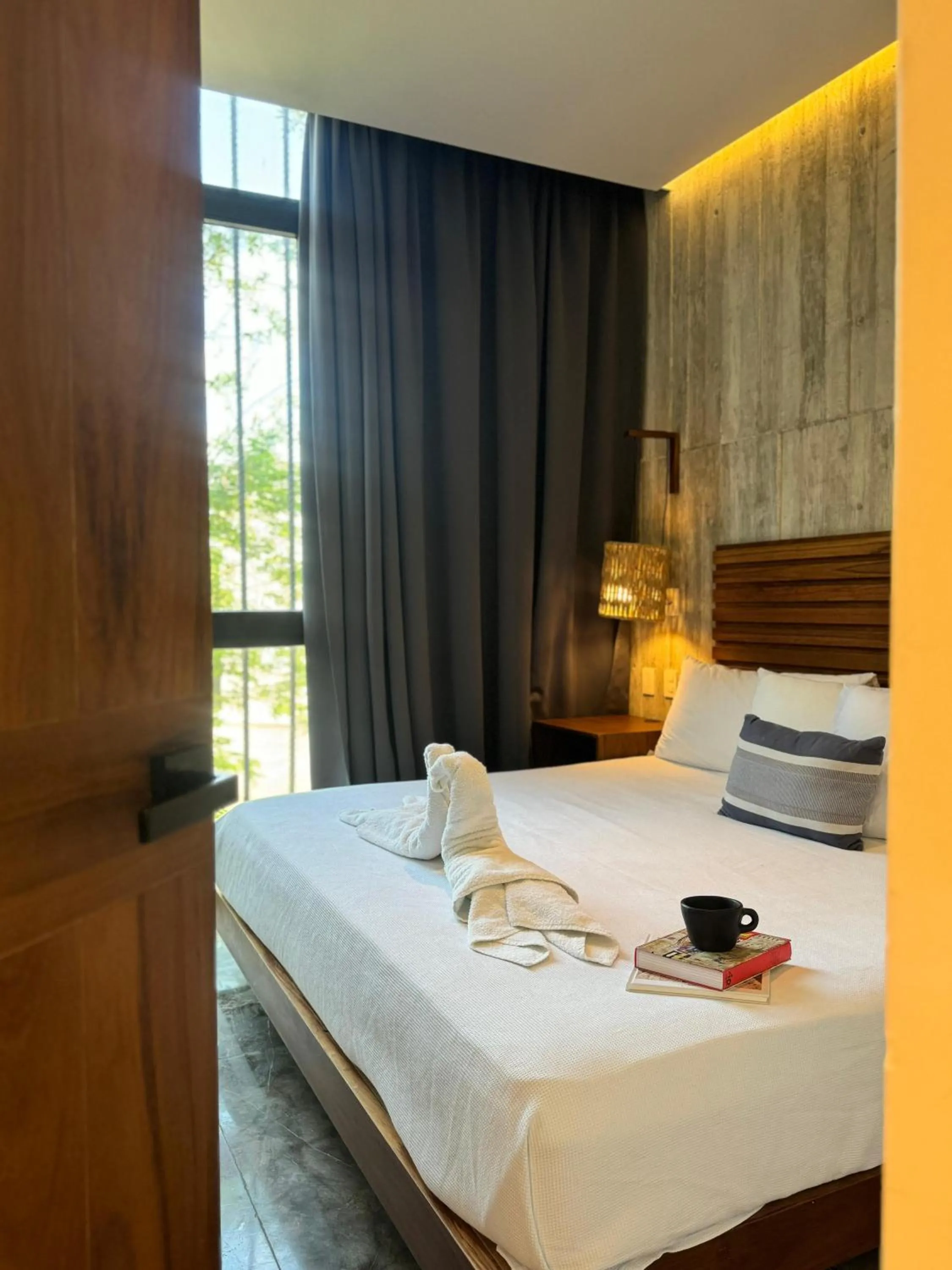 Bed in IIK Tulum by Groovy Stays- A Hip Condo-Hotel with WIFI, Rooftop, Pool, Sleeps 6
