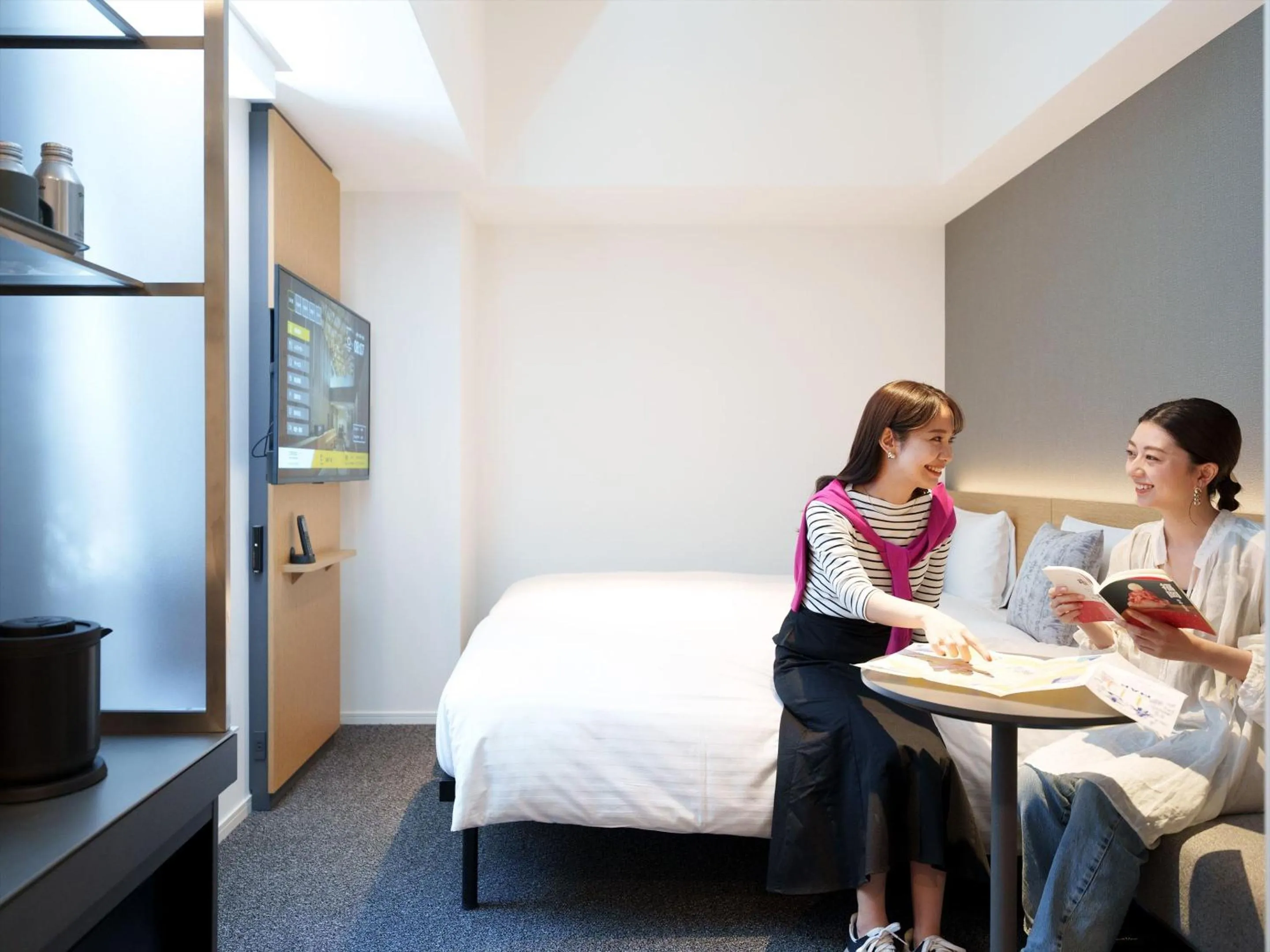 People, Bed in CROSS Life Hakata Yanagibashi