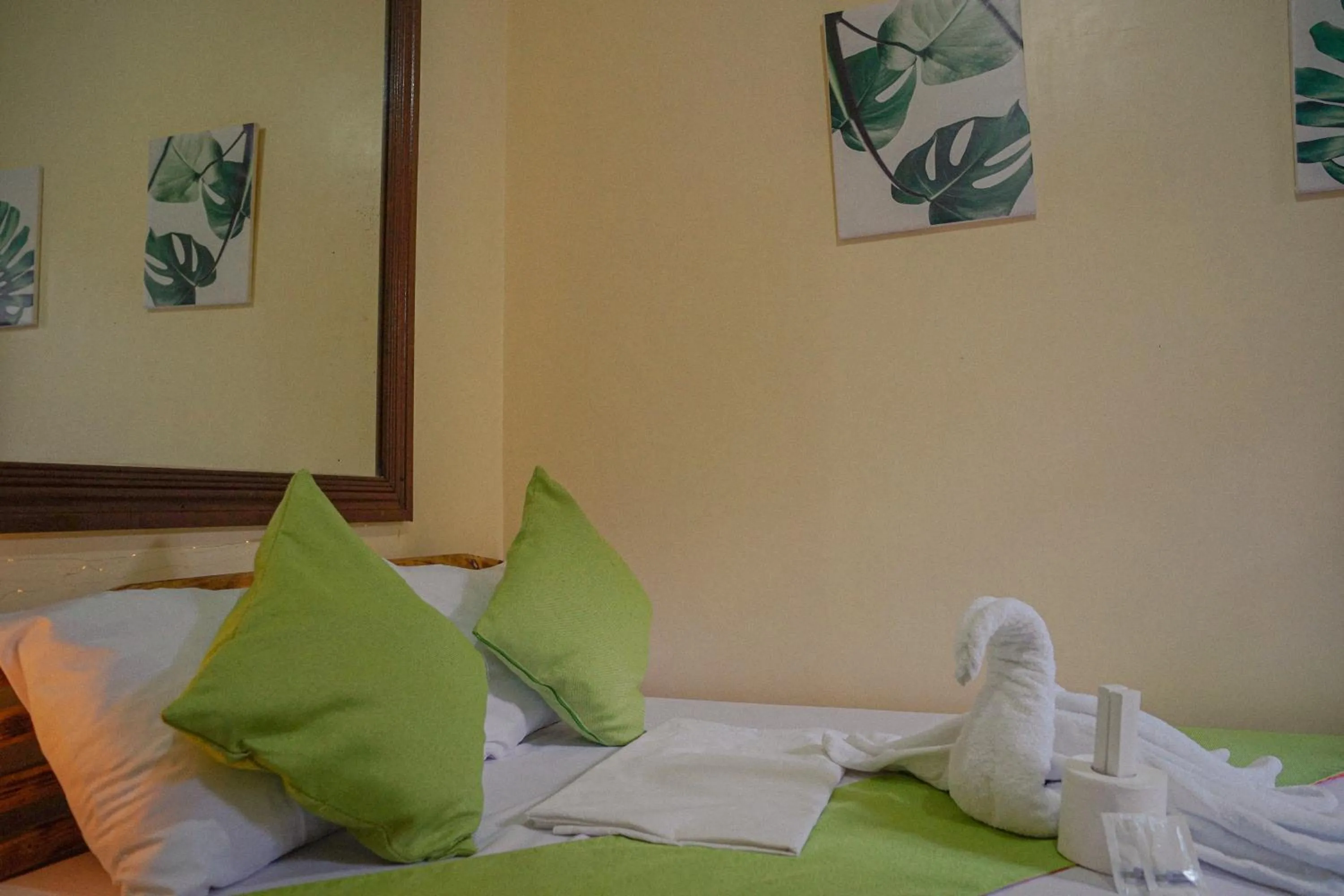 Bed in The Palms Resort & Bar