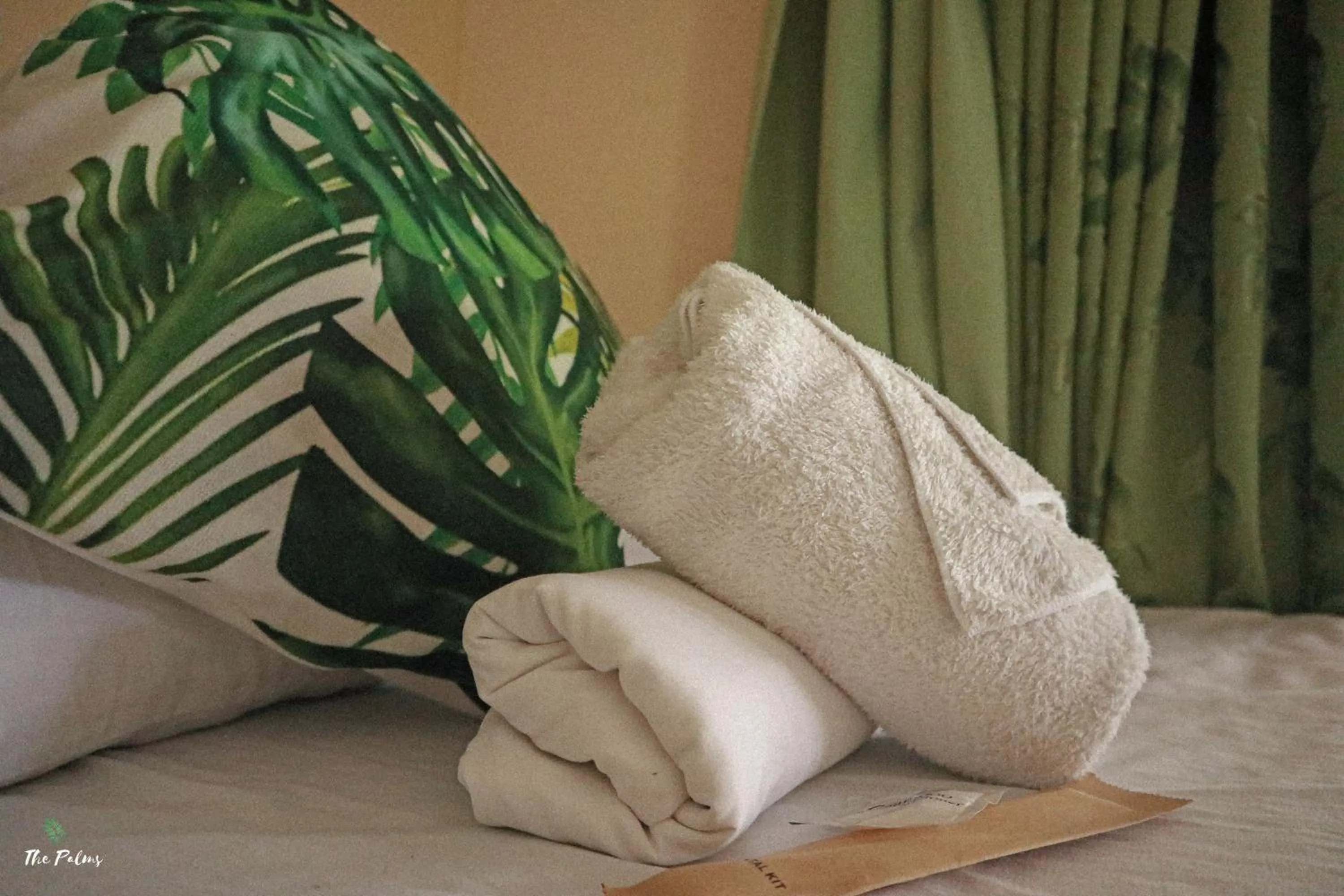 Bed in The Palms Resort & Bar