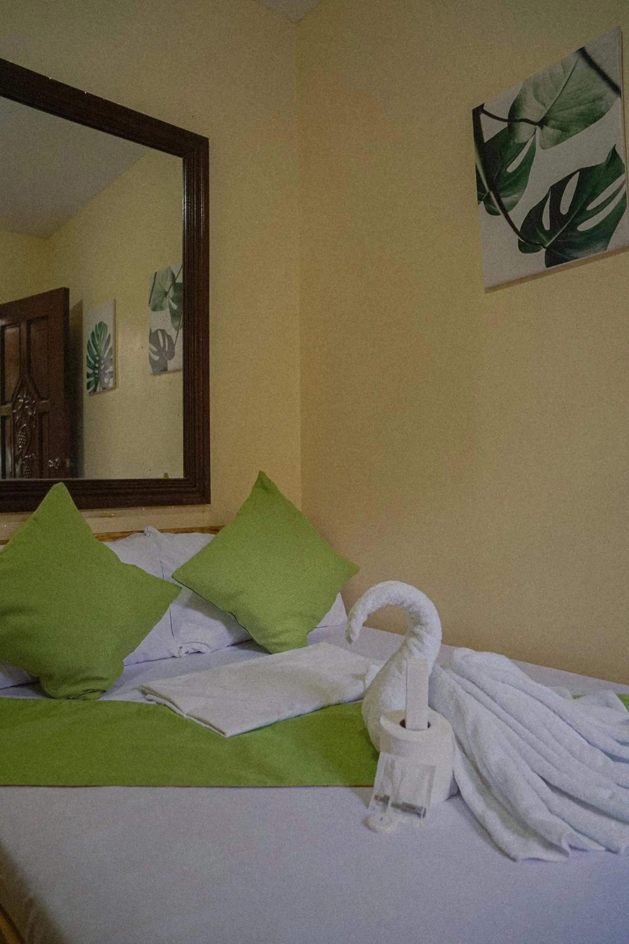 towels, Bed in The Palms Resort & Bar