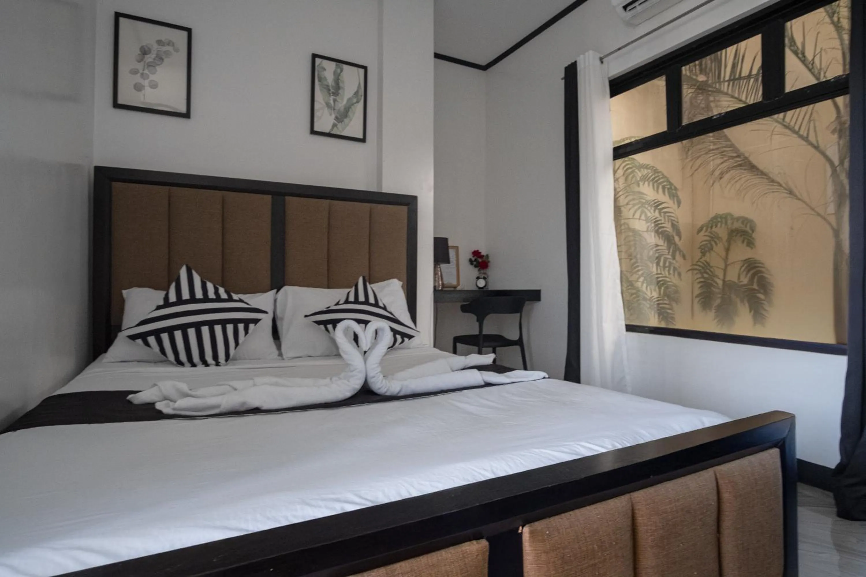 Bed in The Palms Resort & Bar