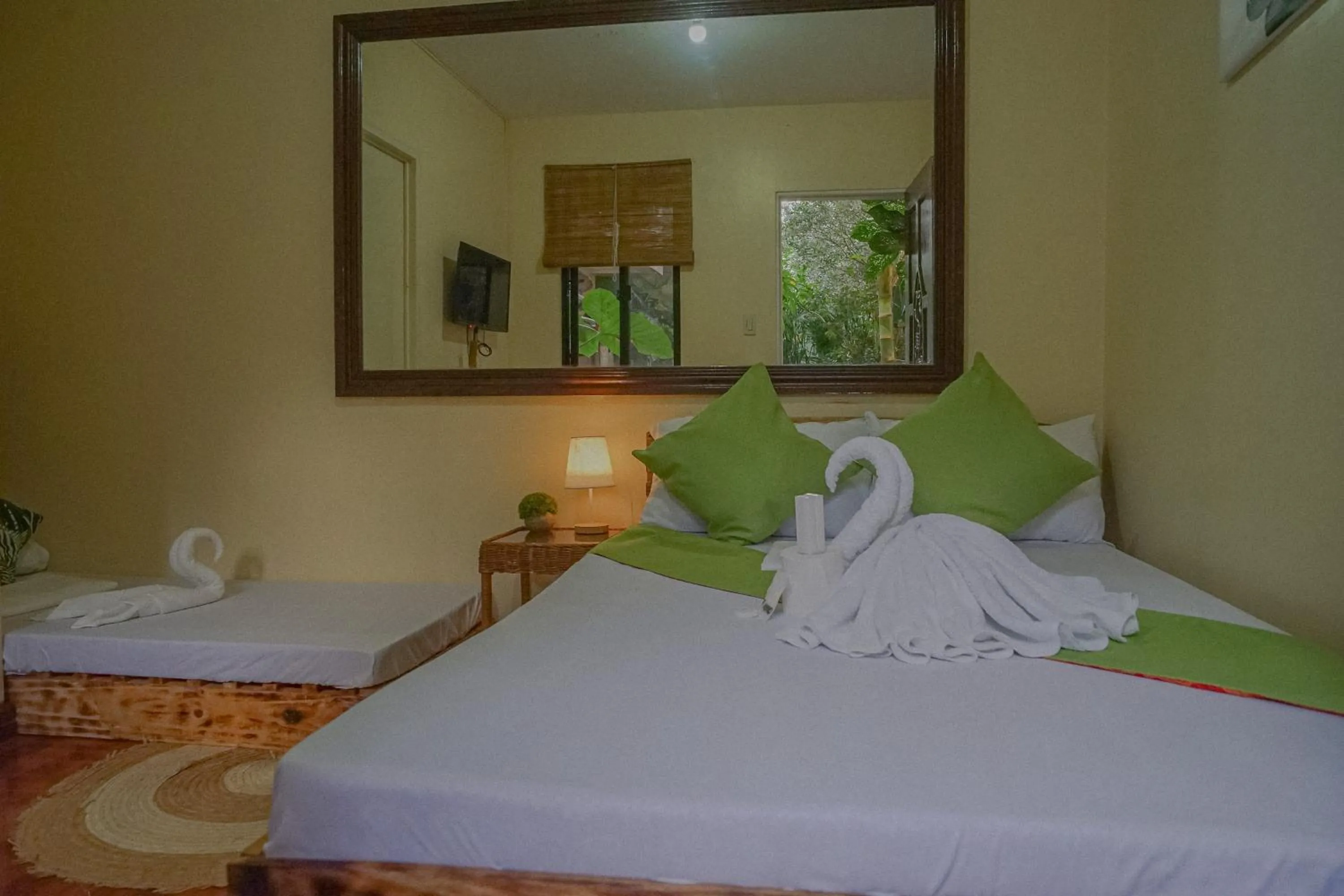 Bed in The Palms Resort & Bar