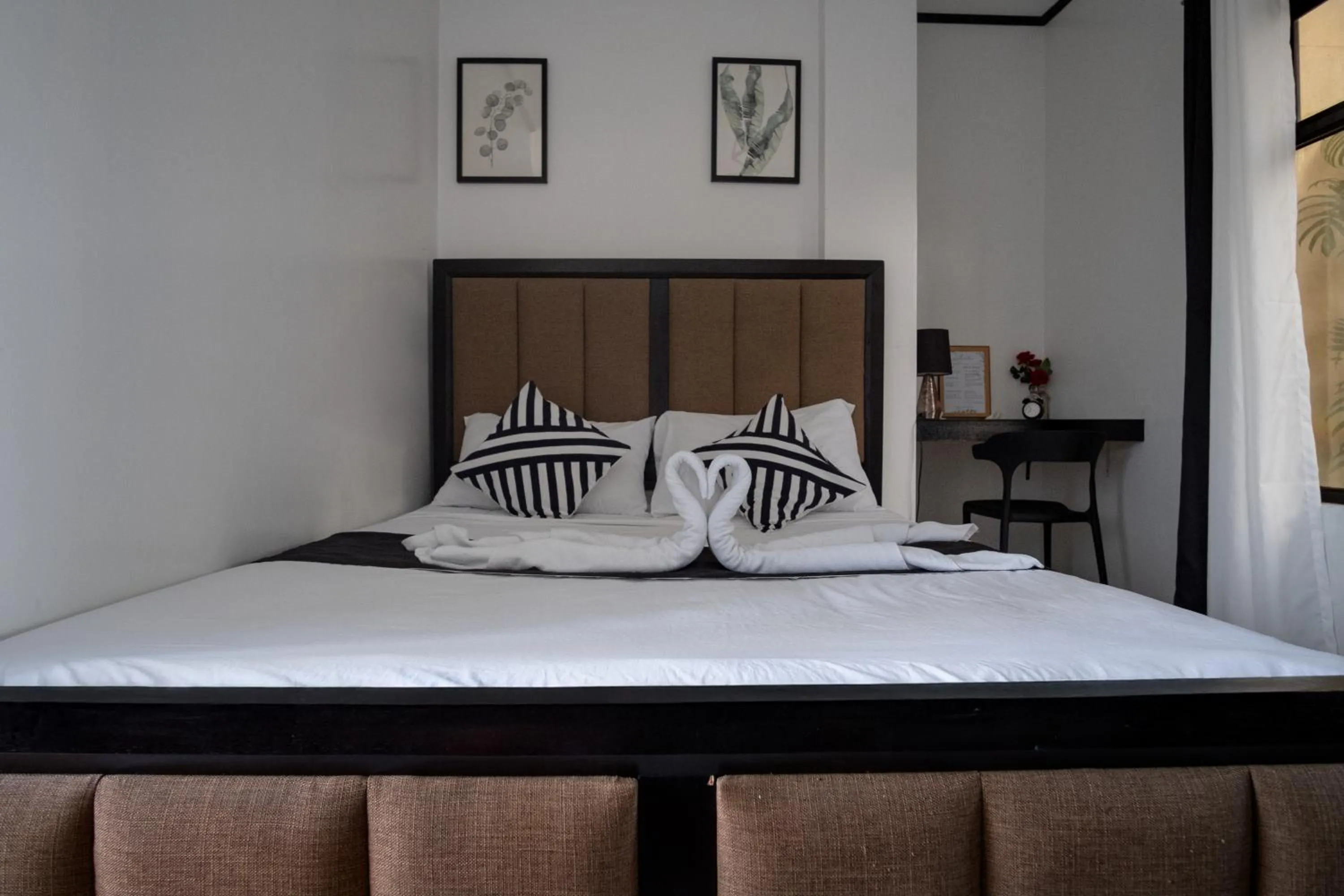 Bed in The Palms Resort & Bar