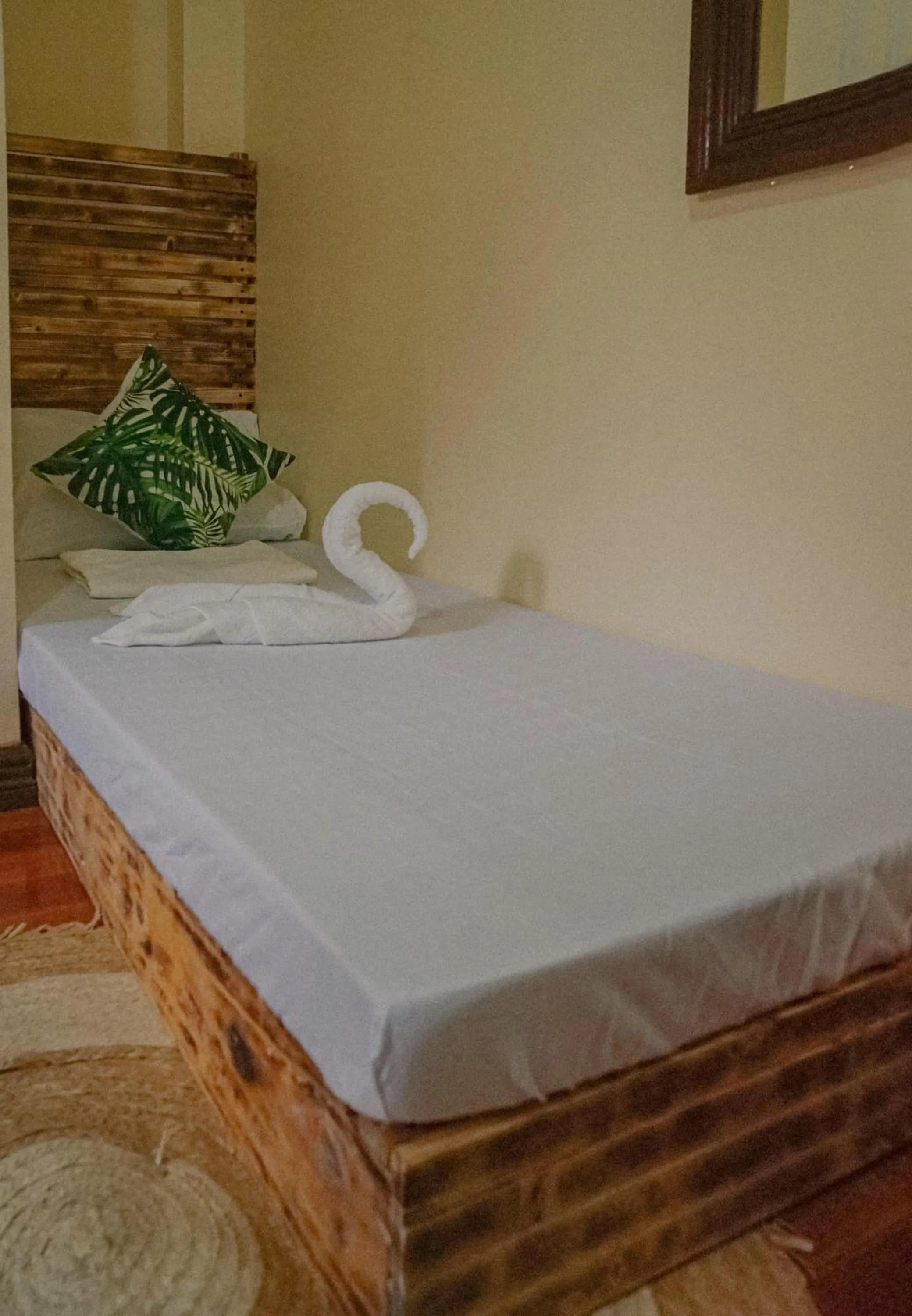 Bed in The Palms Resort & Bar