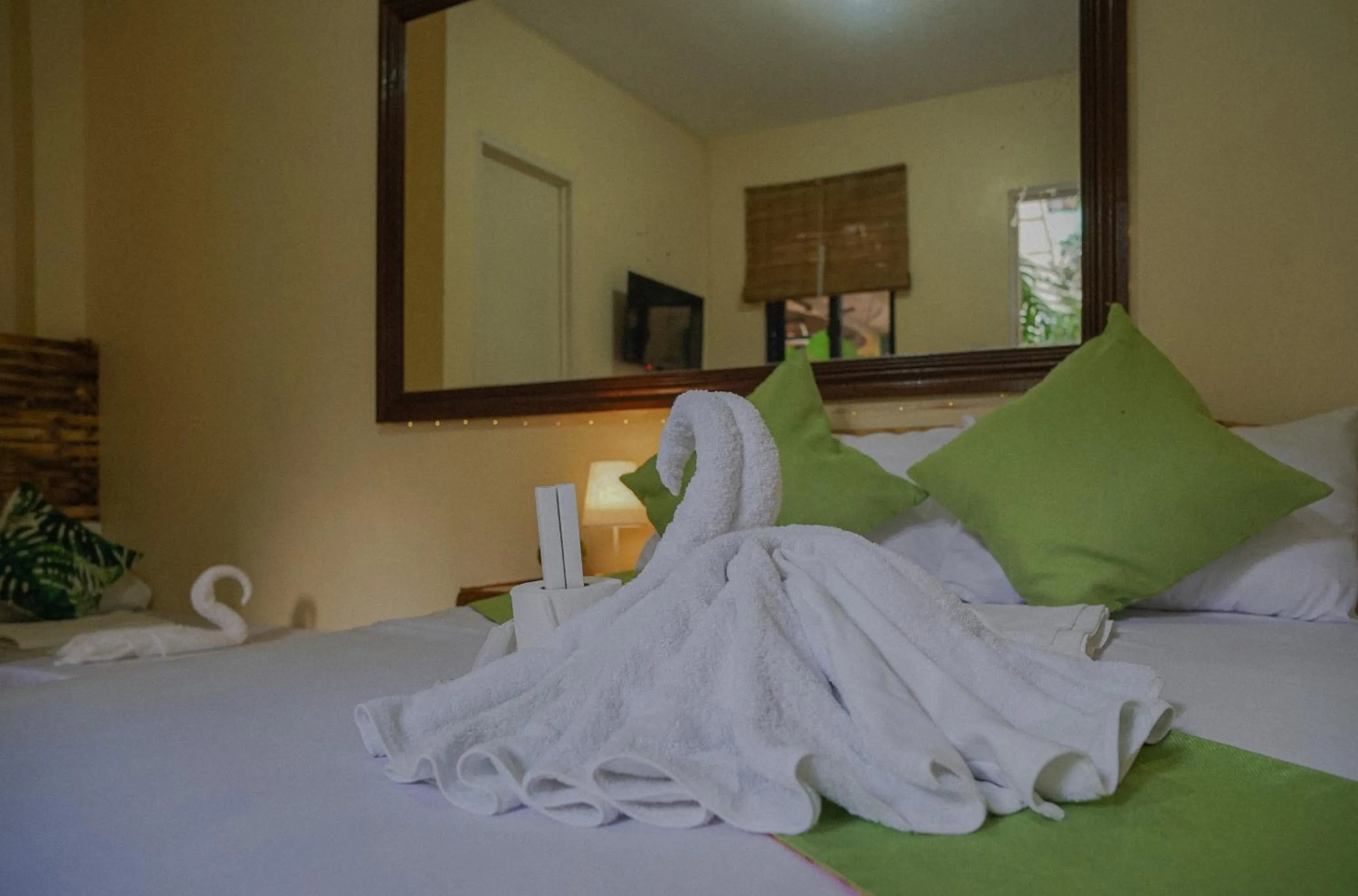 towels, Bed in The Palms Resort & Bar