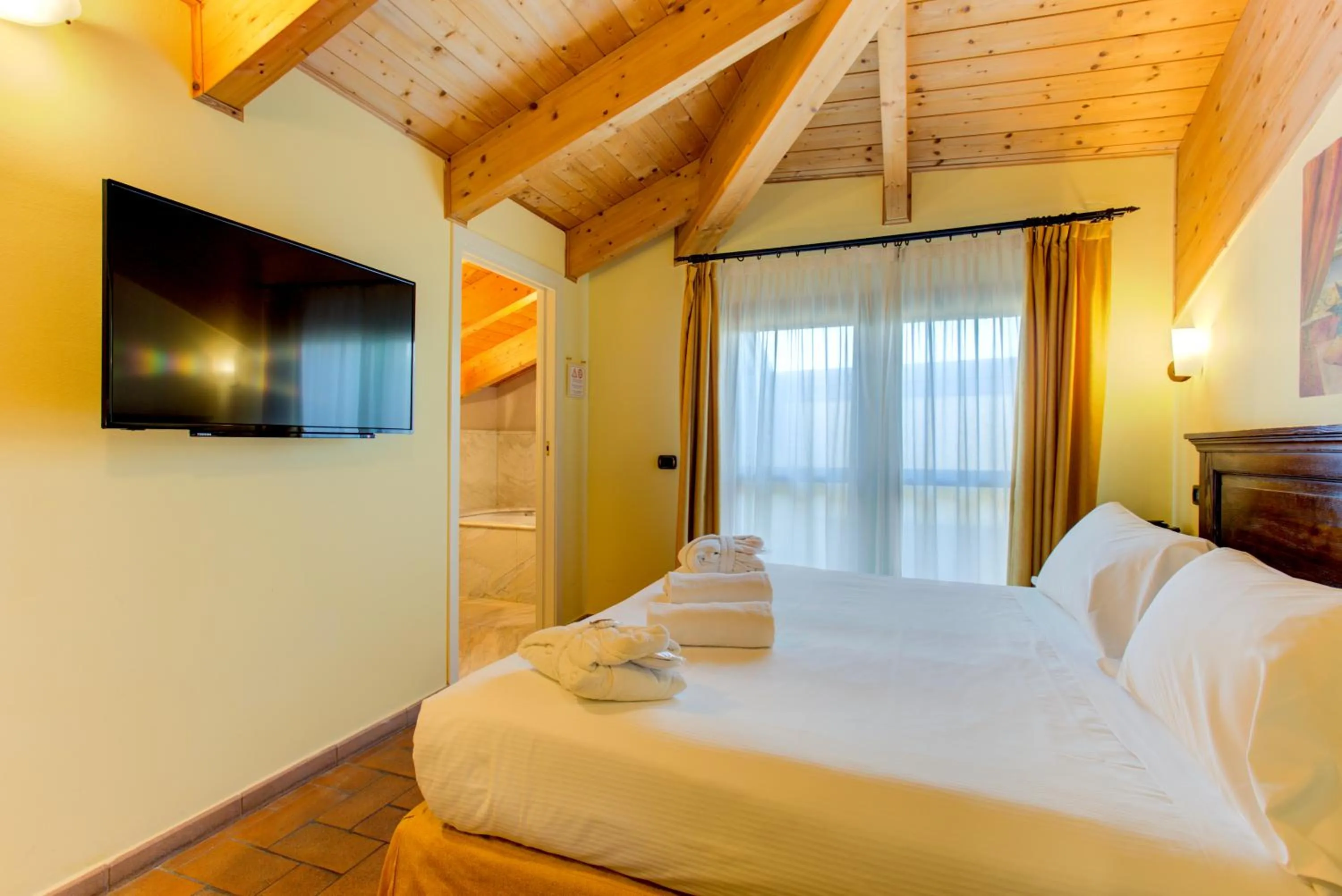 Bedroom, Bed in Oste del Castello Wellness & Bike Hotel