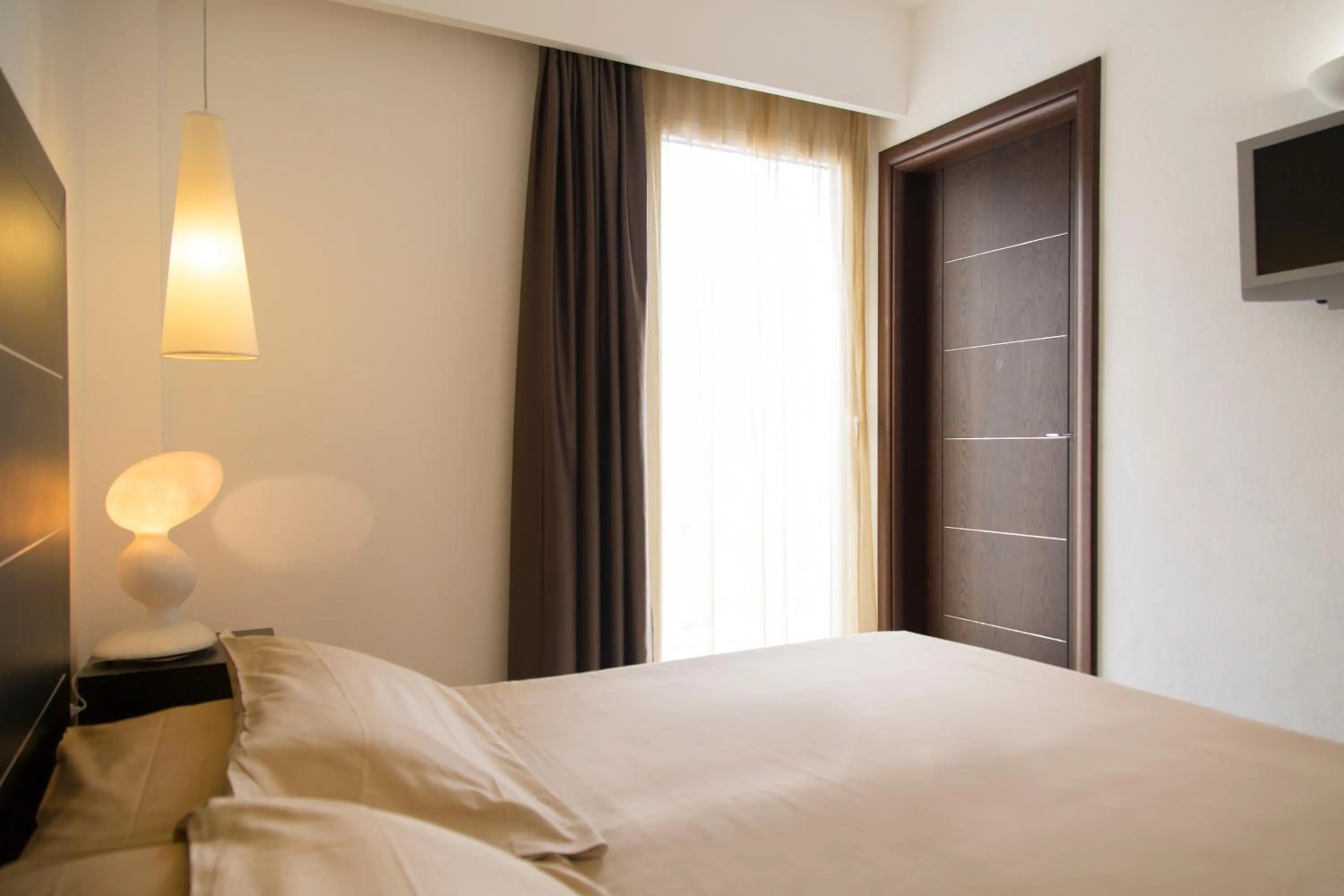 Bed in AHR Baja Hotel & Spa Cannigione