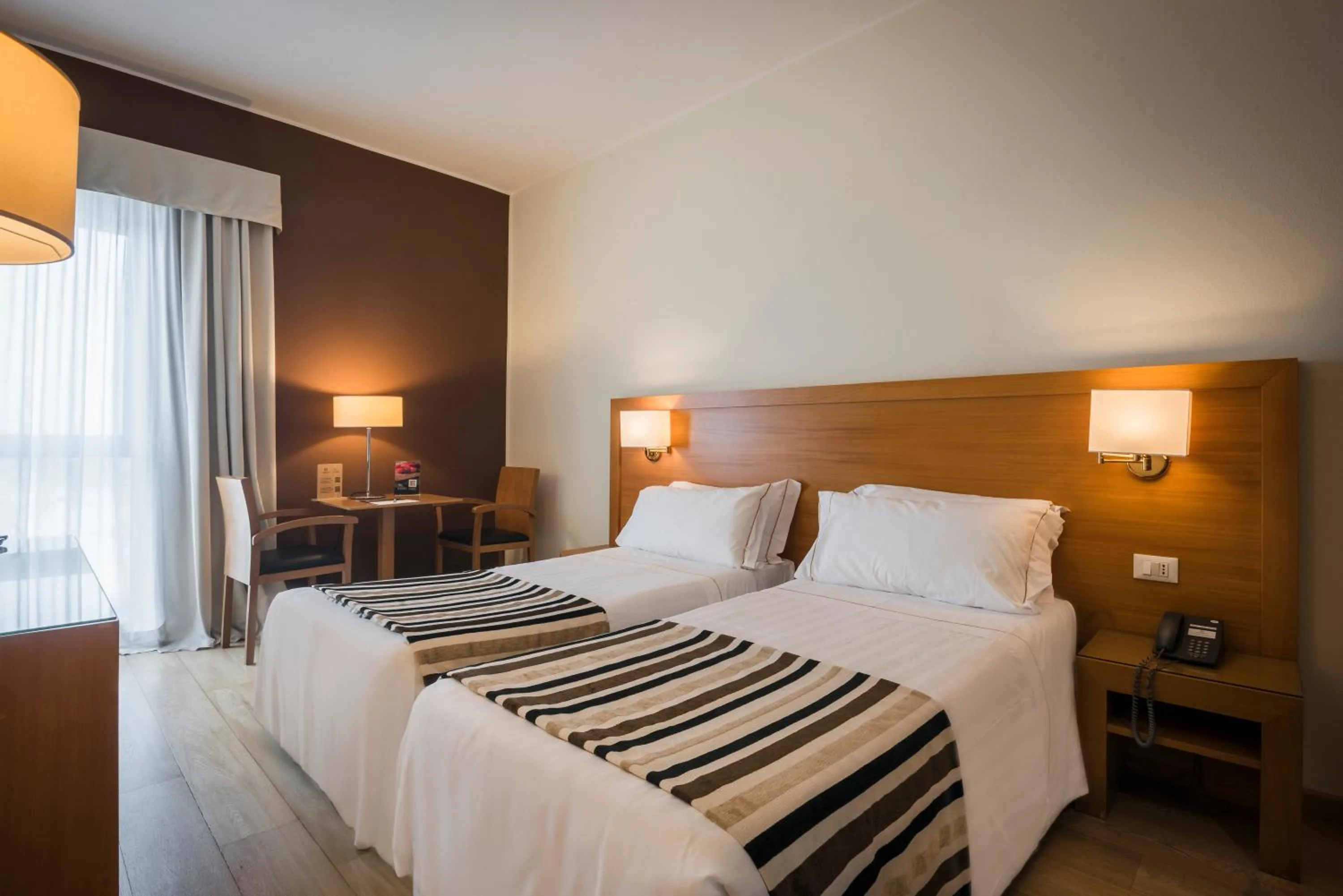 Bed in Sardegna Hotel - Suites & Restaurant