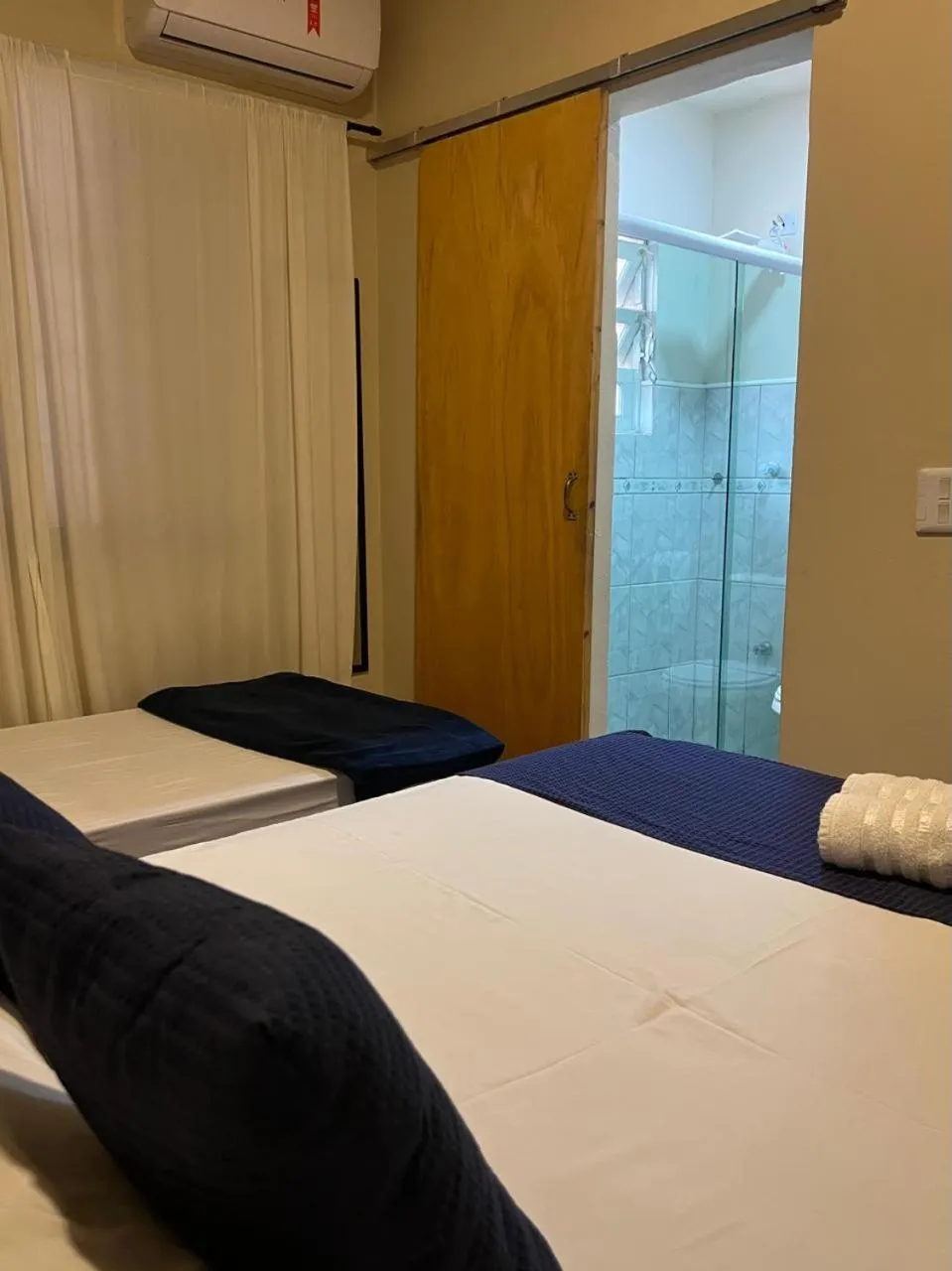 Bed in Pousada Casa Rosada Ilhabela