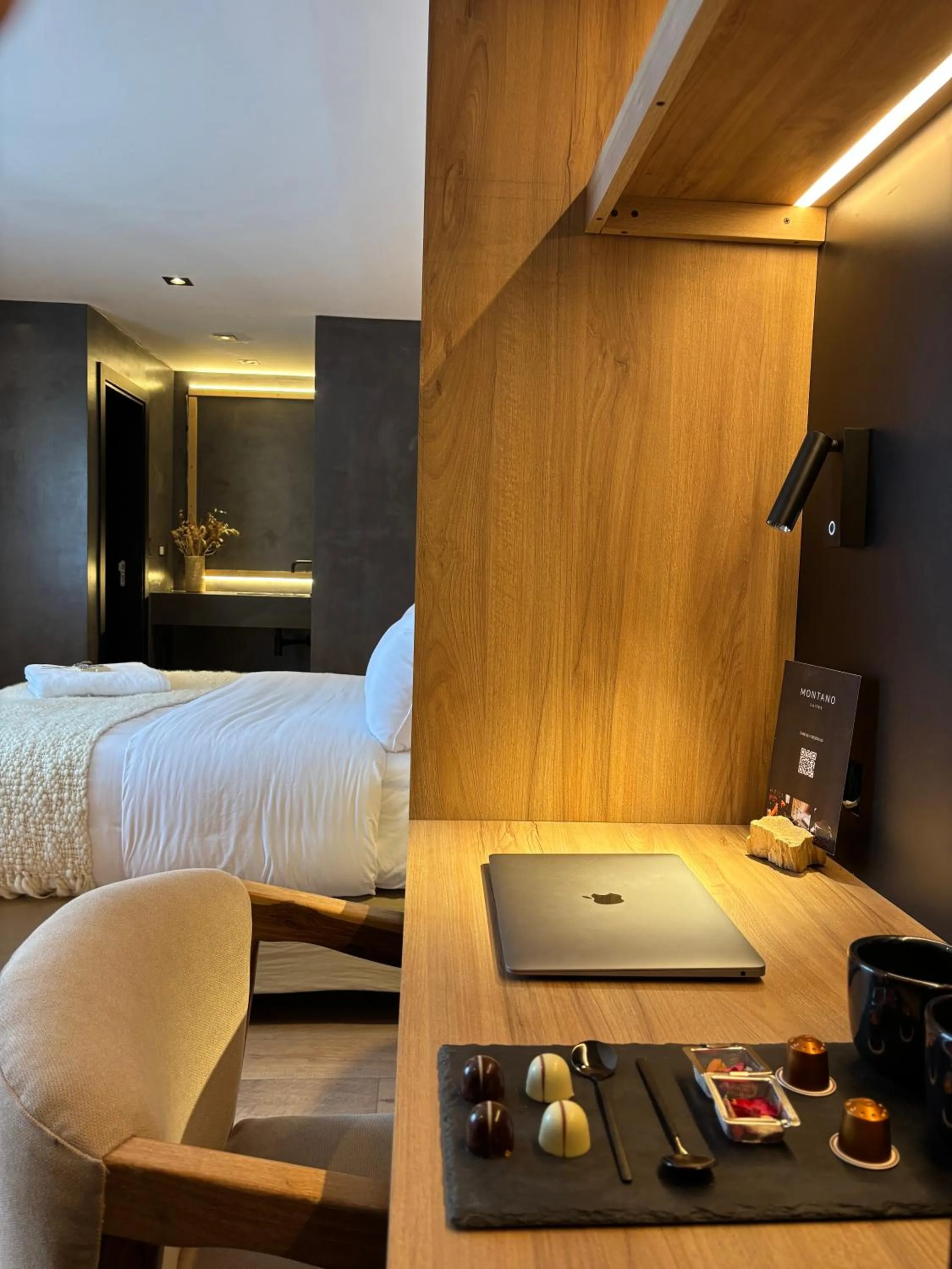 Seating area, Bed in Montano Boutique Suites