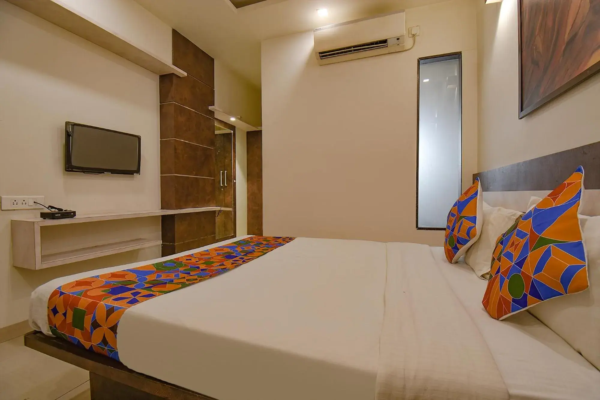 TV and multimedia, Bed in FabHotel Royce Studio Apartments - Nr Pune International Airport TV and multimedia, Bed in FabHotel Royce Studio Apartments - Nr Pune International Airport