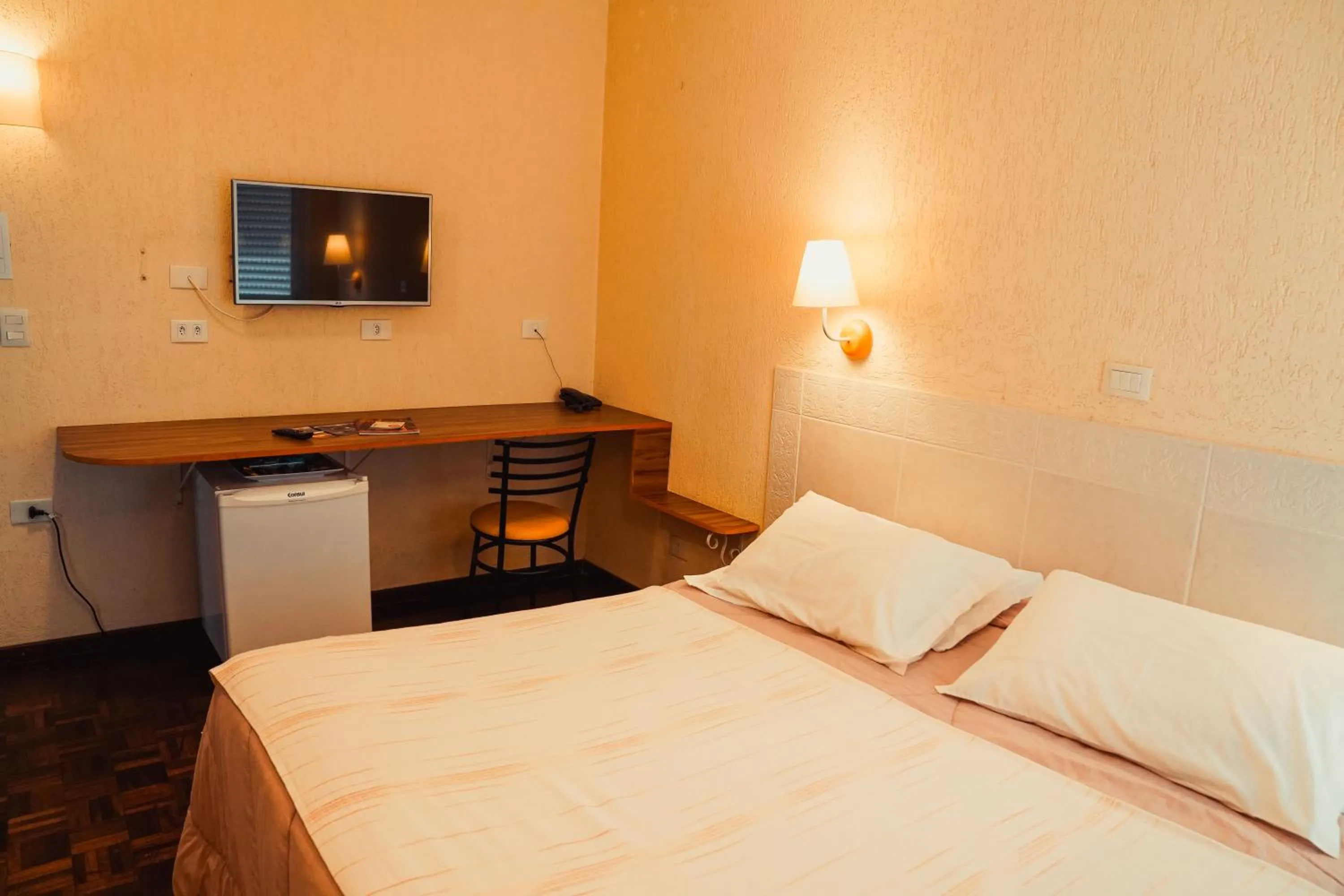 Bed in Pousada do Anhangava