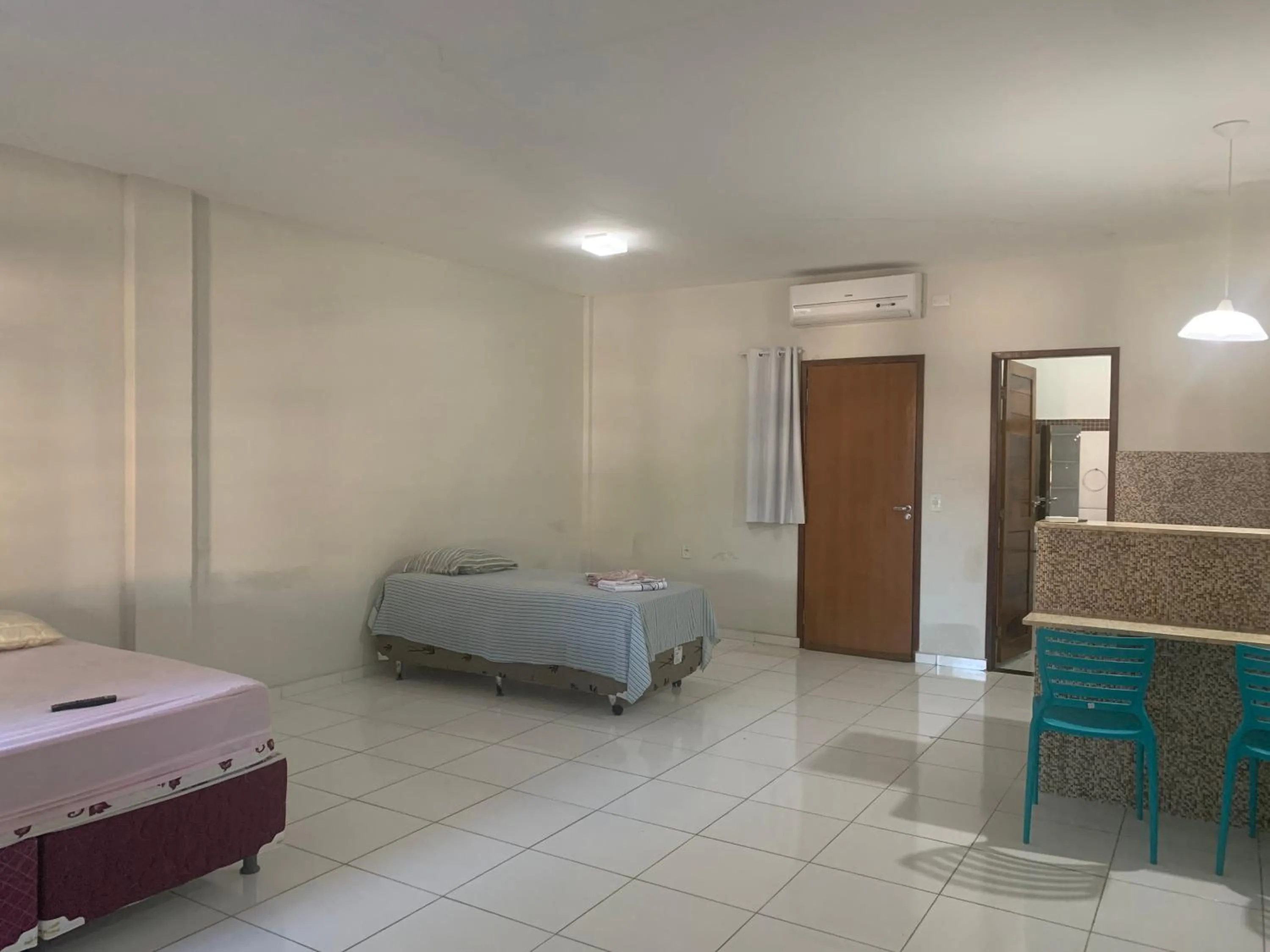 Bed in Pousada Vovó Haidê