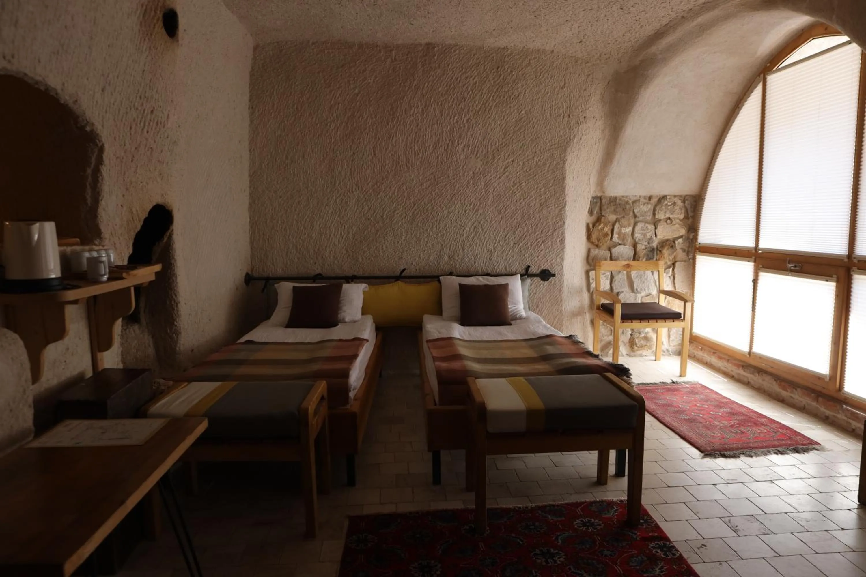 Bed in Pinhan Cave Suites