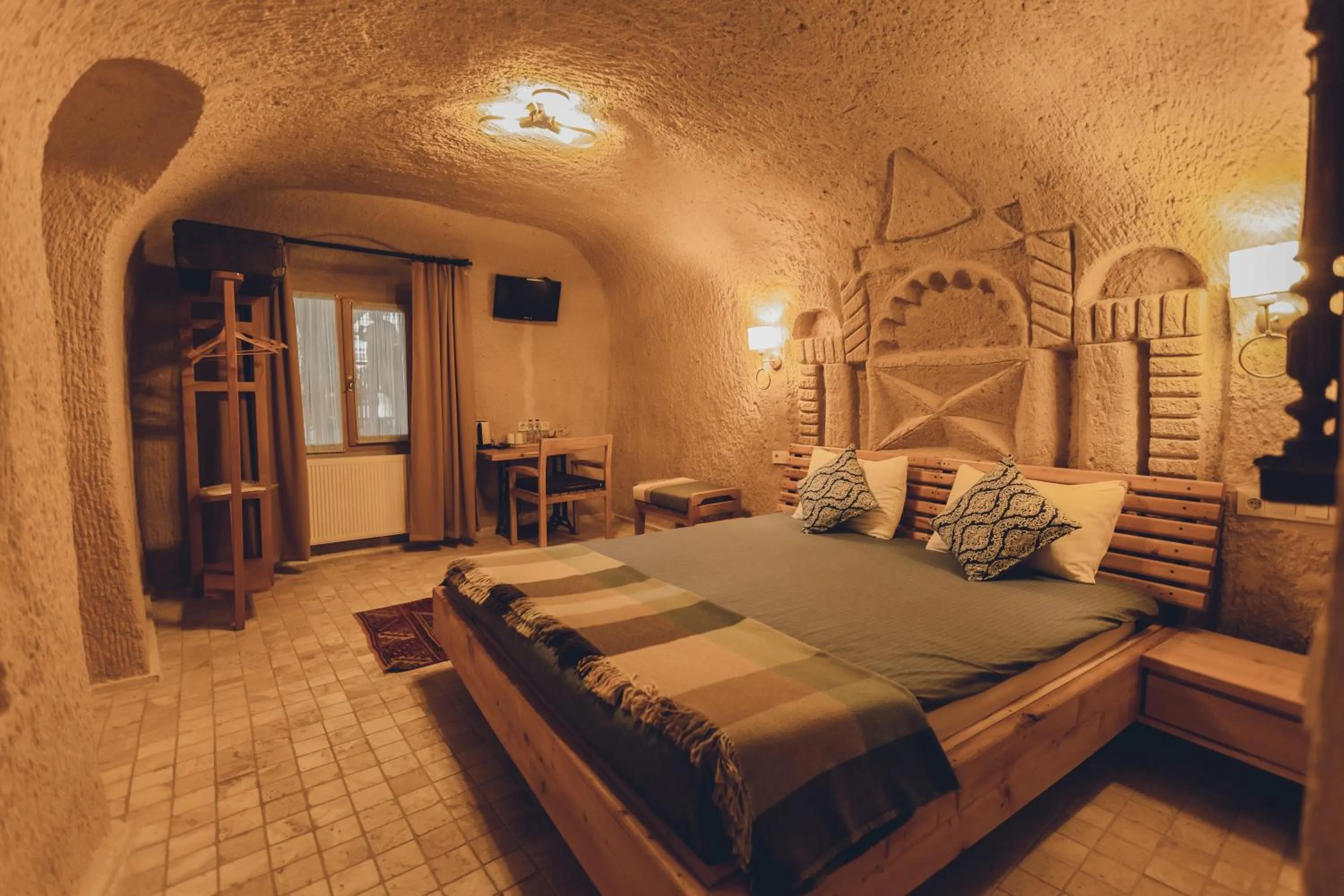 Bed in Pinhan Cave Suites