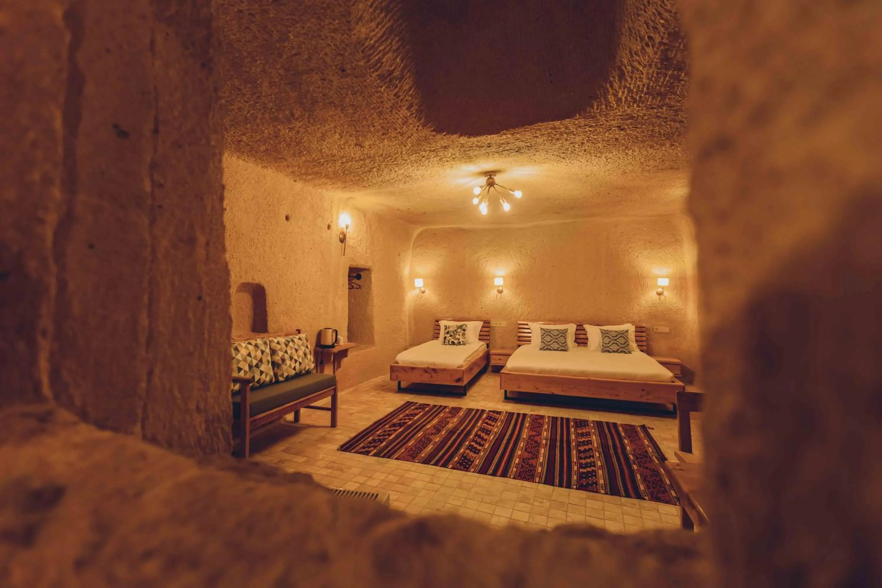 Bed in Pinhan Cave Suites