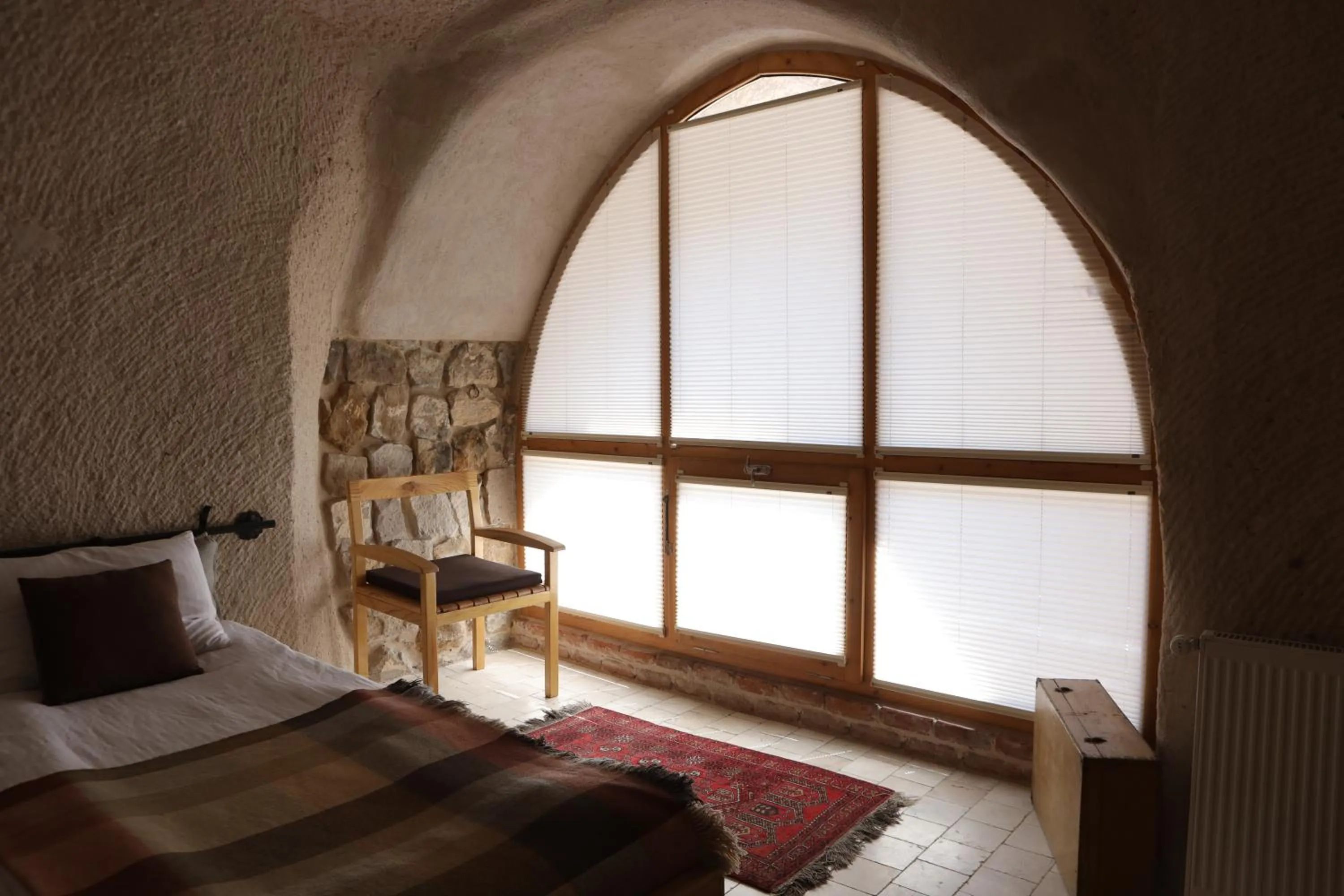 Bed in Pinhan Cave Suites