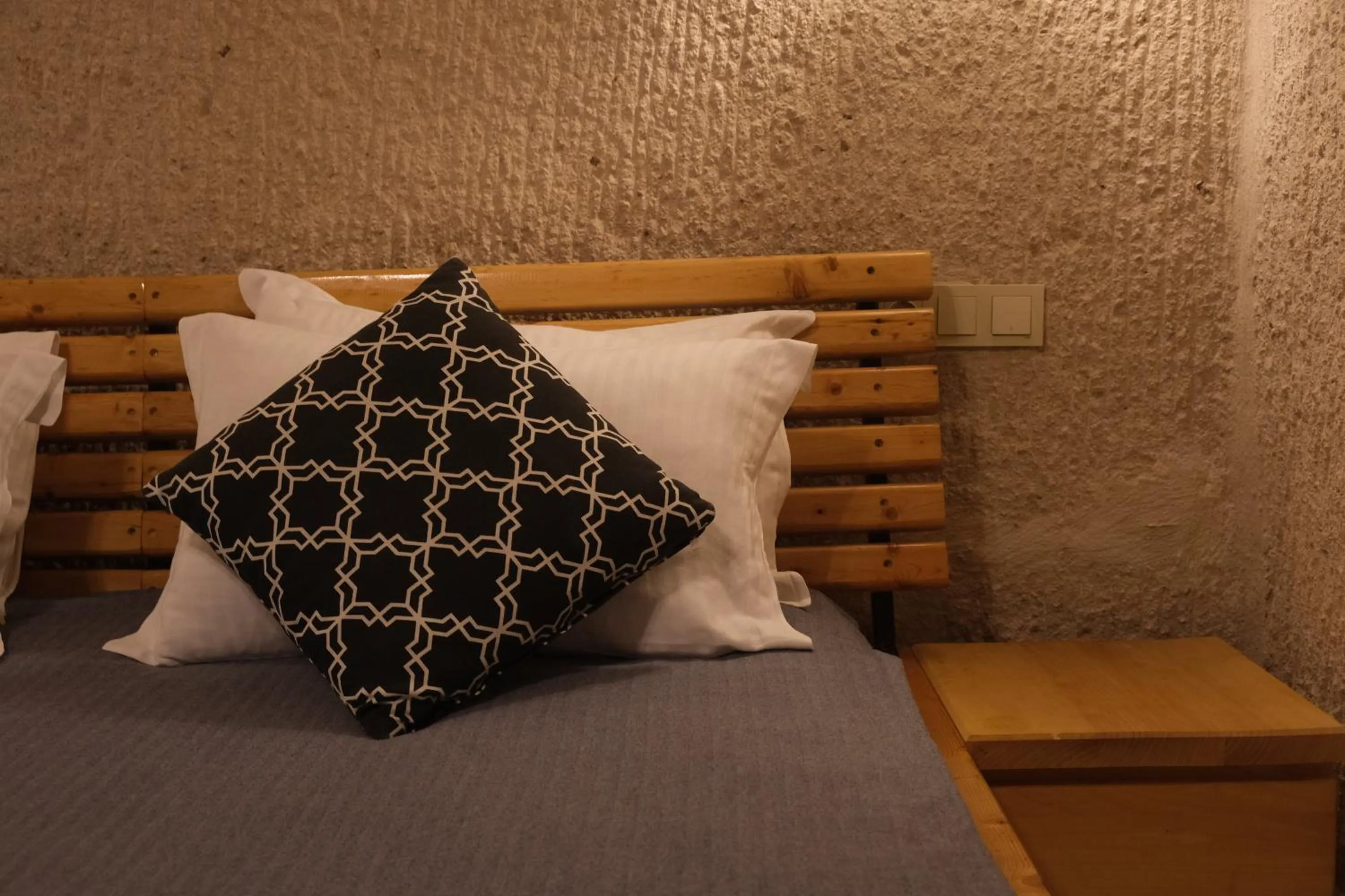 Bed in Pinhan Cave Suites