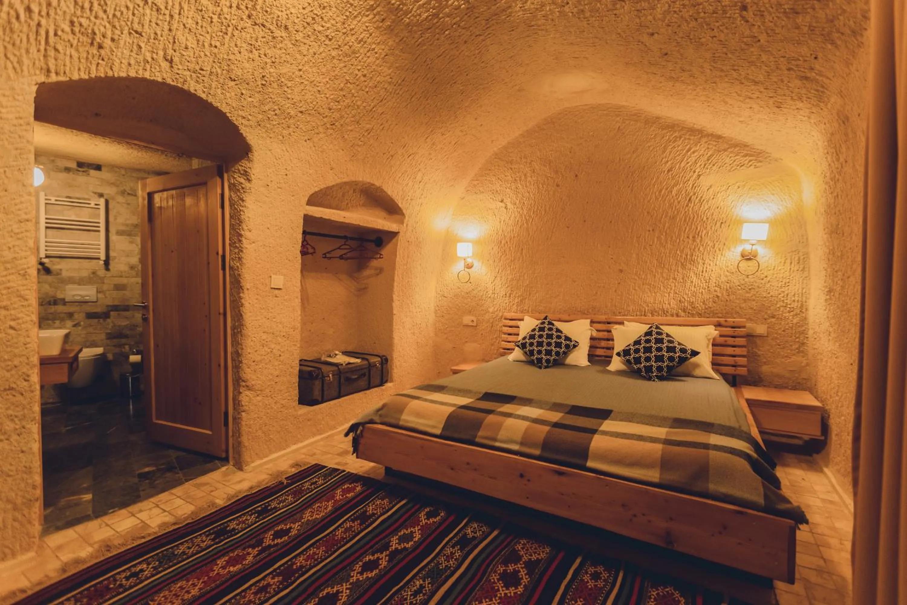 Bed in Pinhan Cave Suites