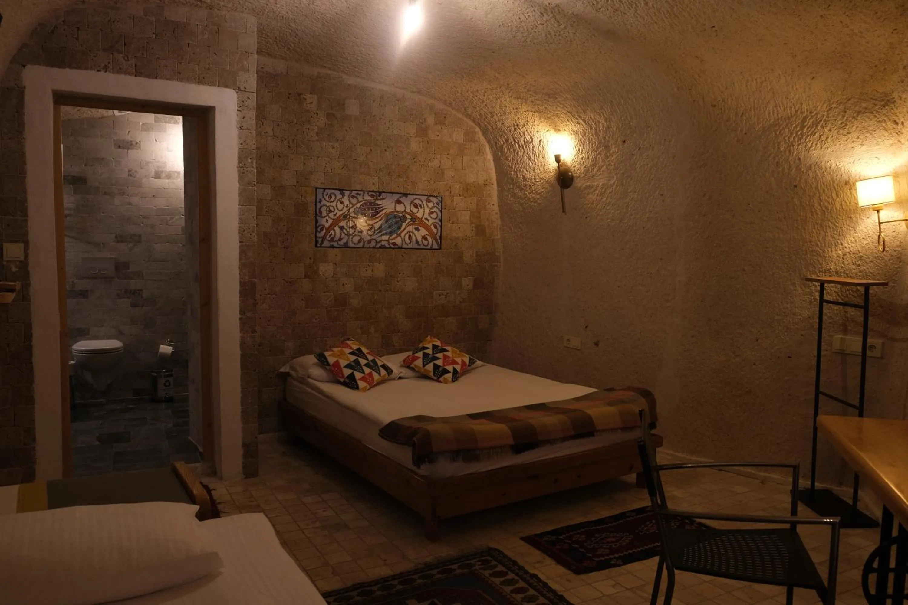 Bed in Pinhan Cave Suites