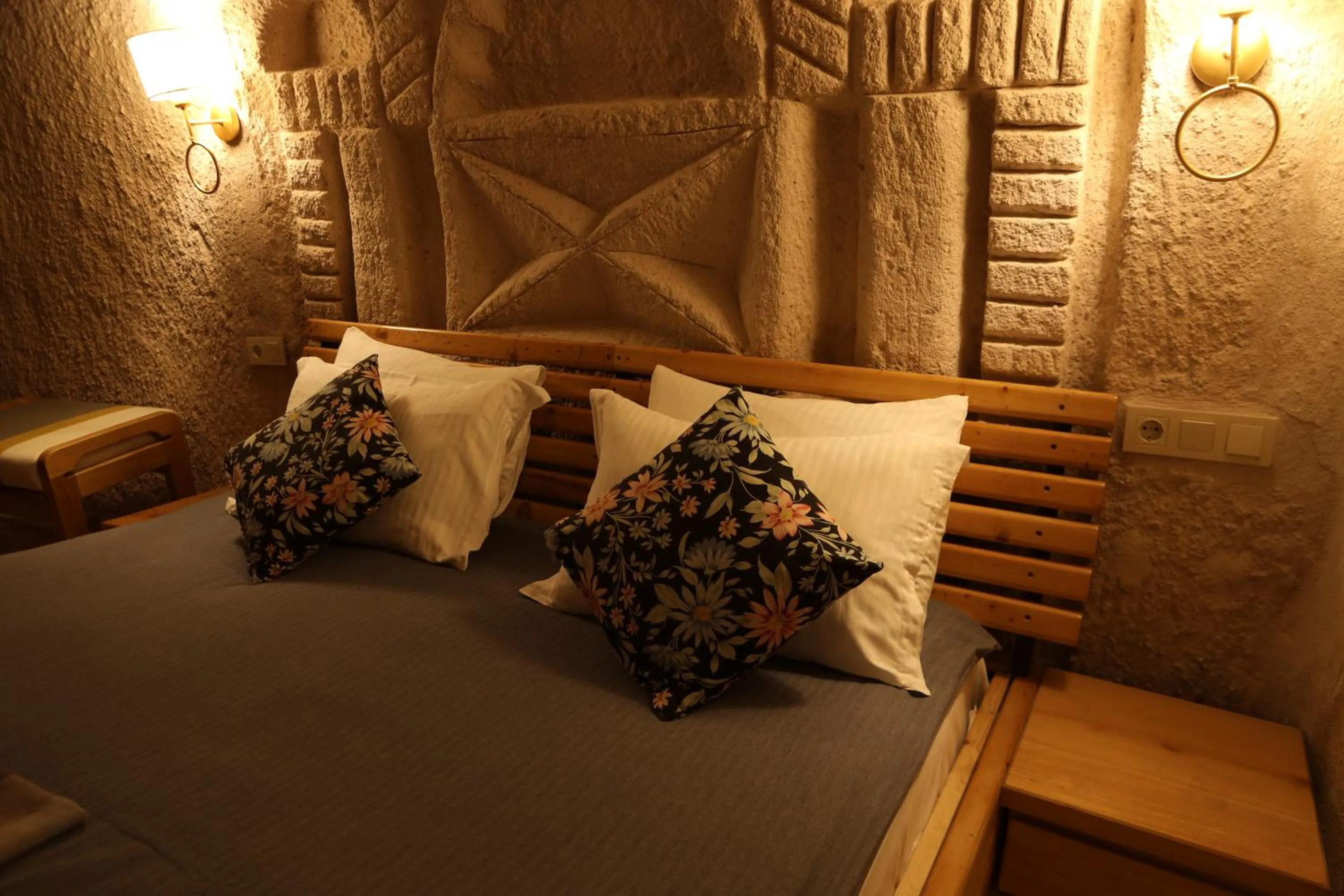 Bed in Pinhan Cave Suites