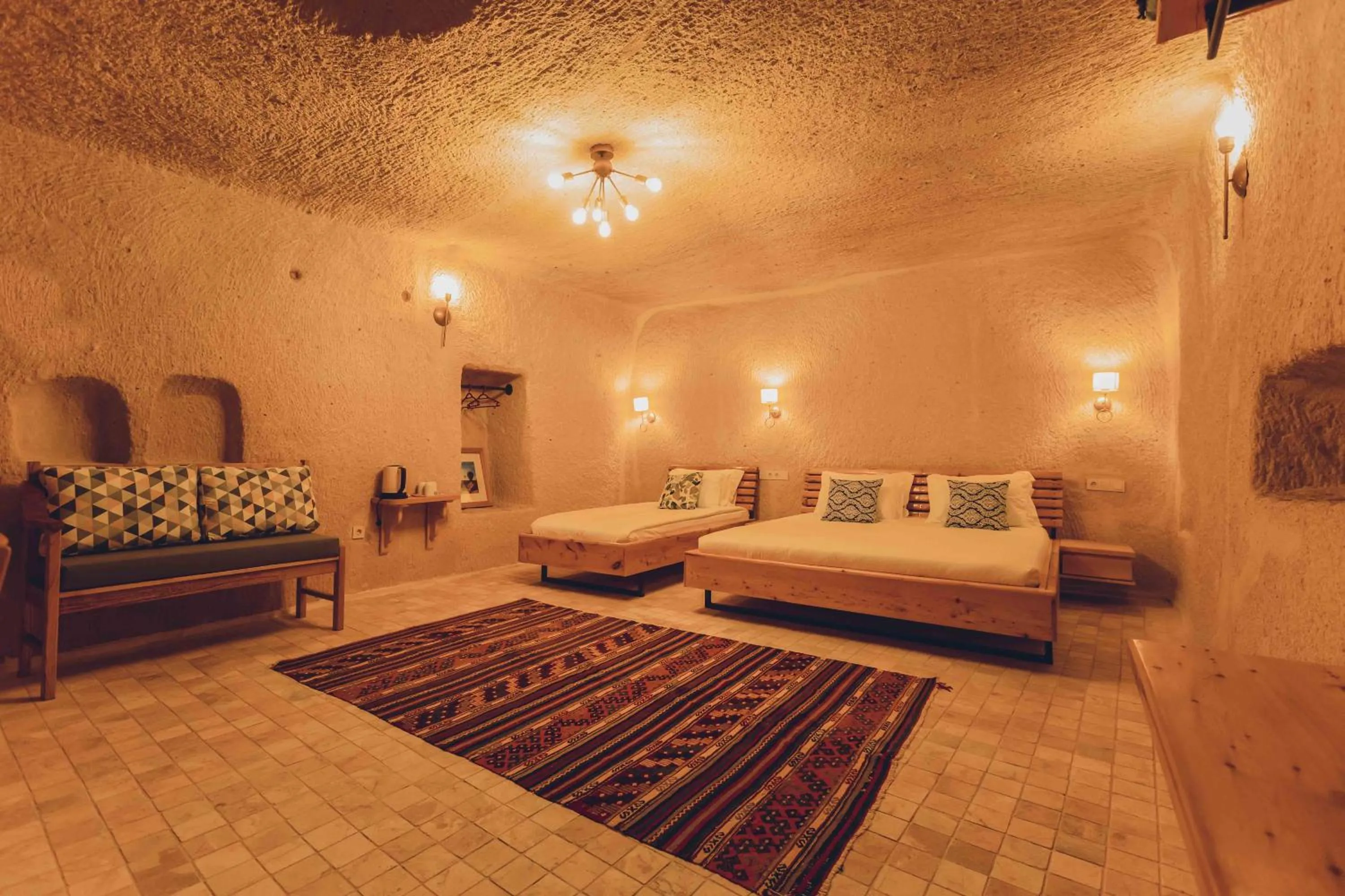Bed in Pinhan Cave Suites