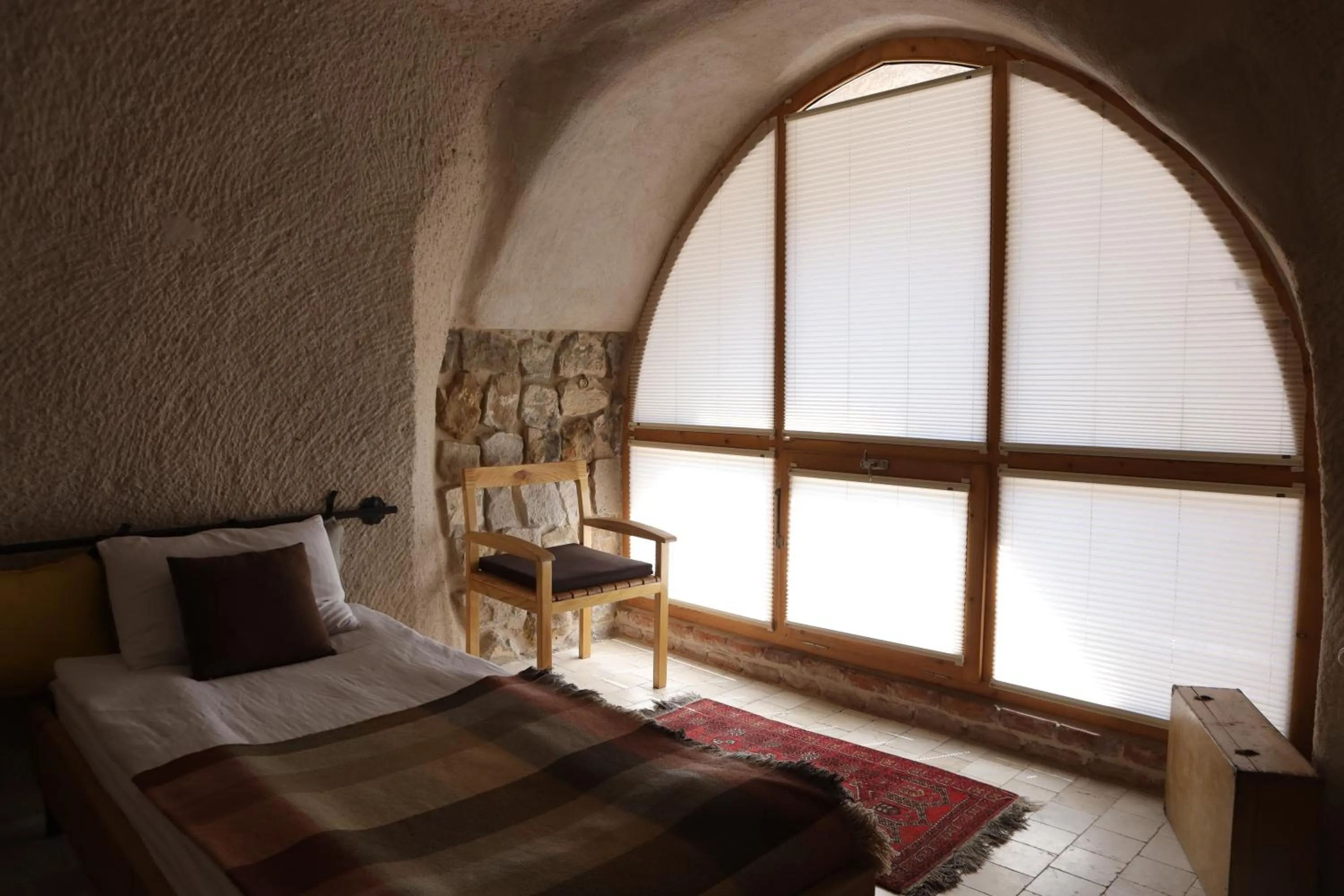 Bed in Pinhan Cave Suites